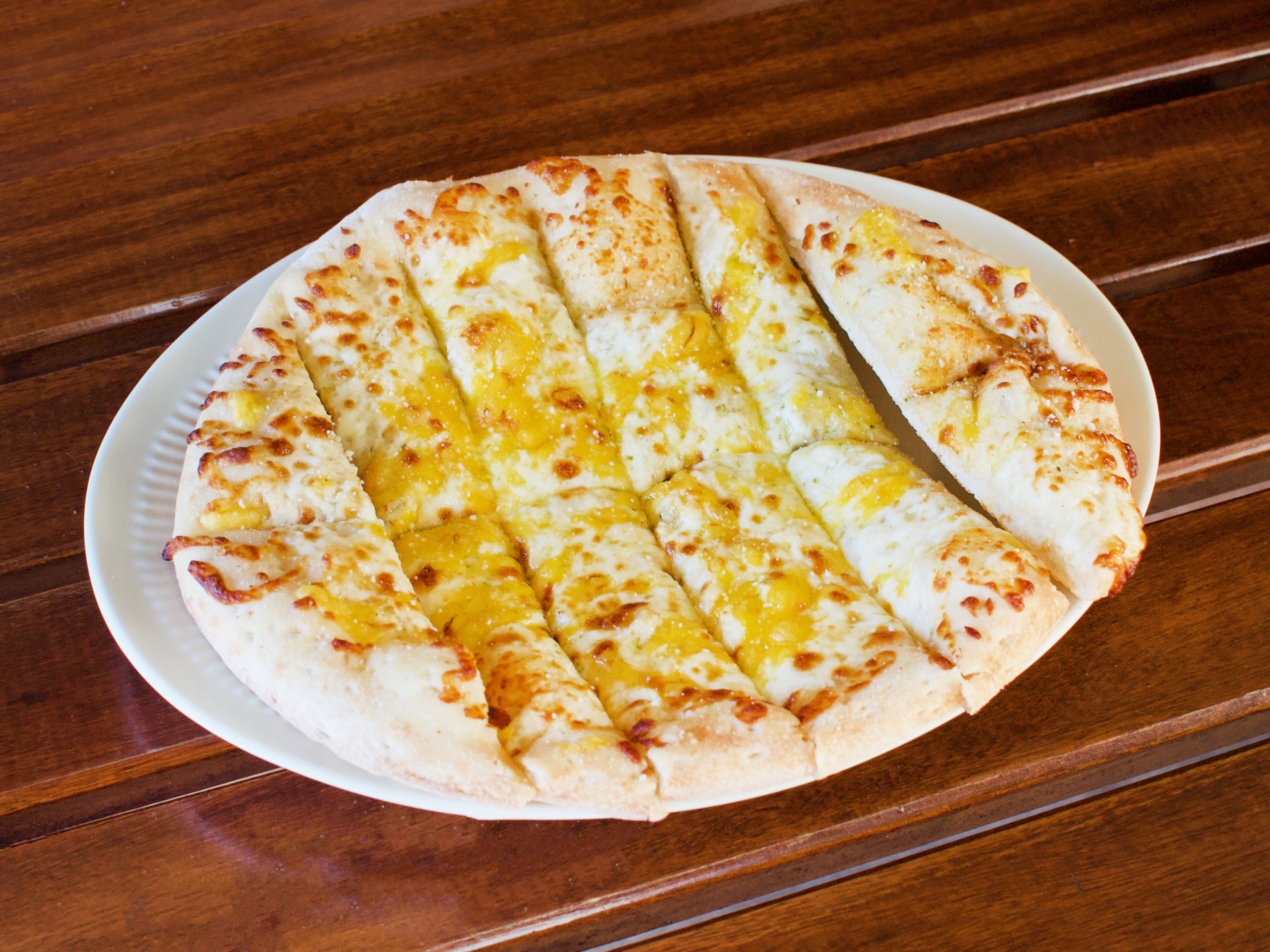 Order 12 Cheesesticks food online from Vocelli Pizza store, Ashburn on bringmethat.com