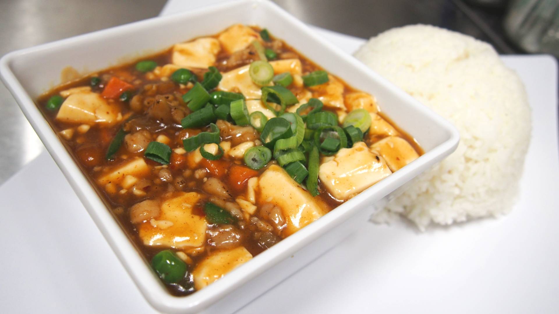 Order Mapo Tofu Plated Rice (Spicy) food online from Bite Feast store, Davis on bringmethat.com