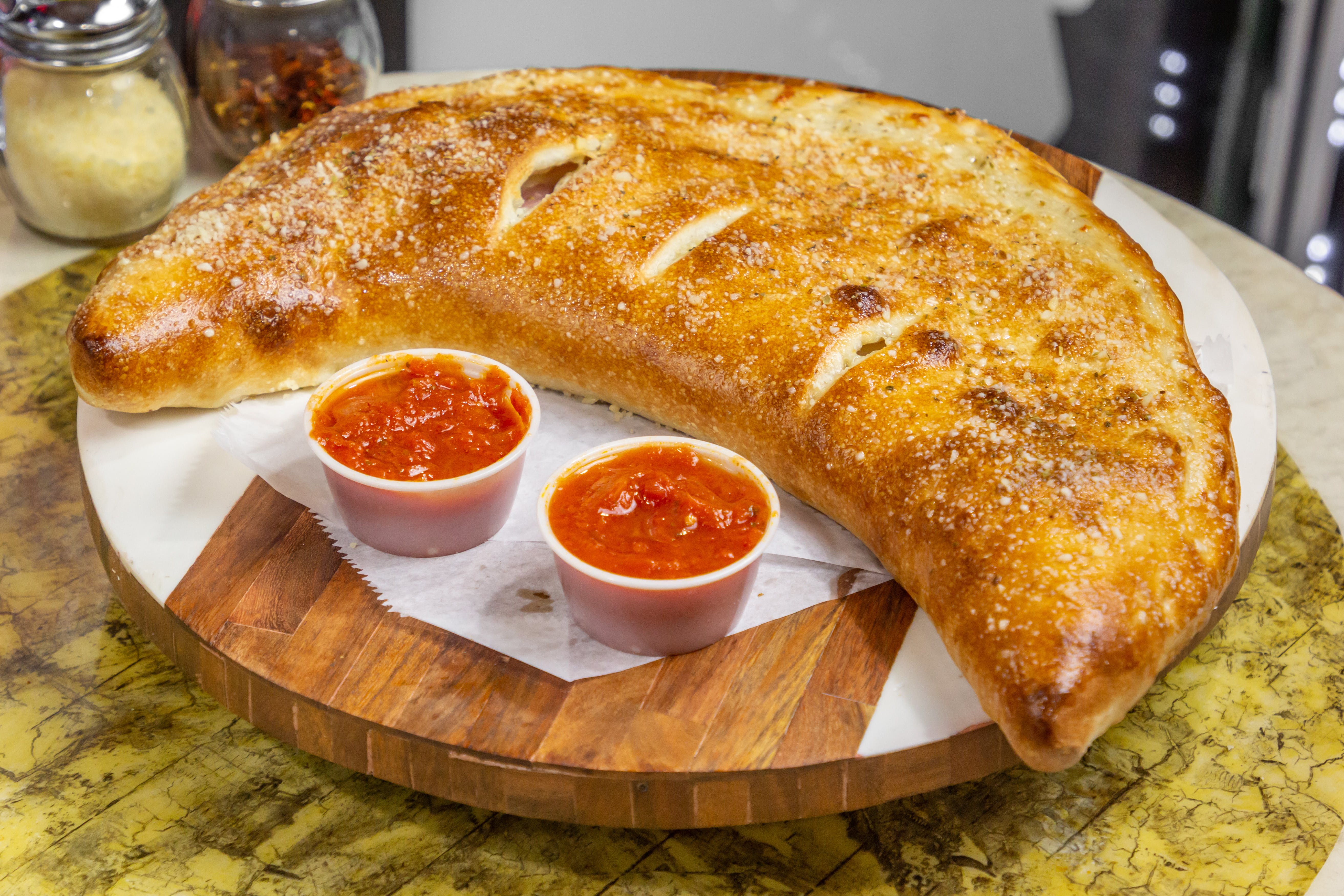 Order Mozzarella & Ricotta Cheese Calzone - Calzone food online from Cafe Lark store, Albany on bringmethat.com