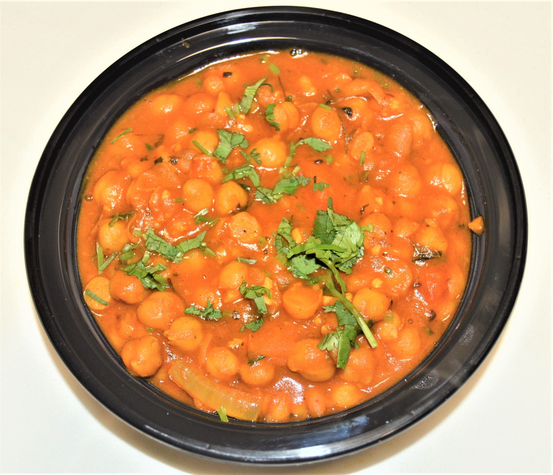Order 57. Chole - Chickpeas food online from Salt And Pepper Grill Iii store, Washington on bringmethat.com