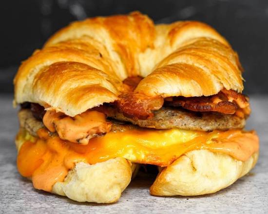 Order Croissant, Bacon, Sausage, Egg ,& Cheddar food online from Breakfast in Bed store, Troy on bringmethat.com