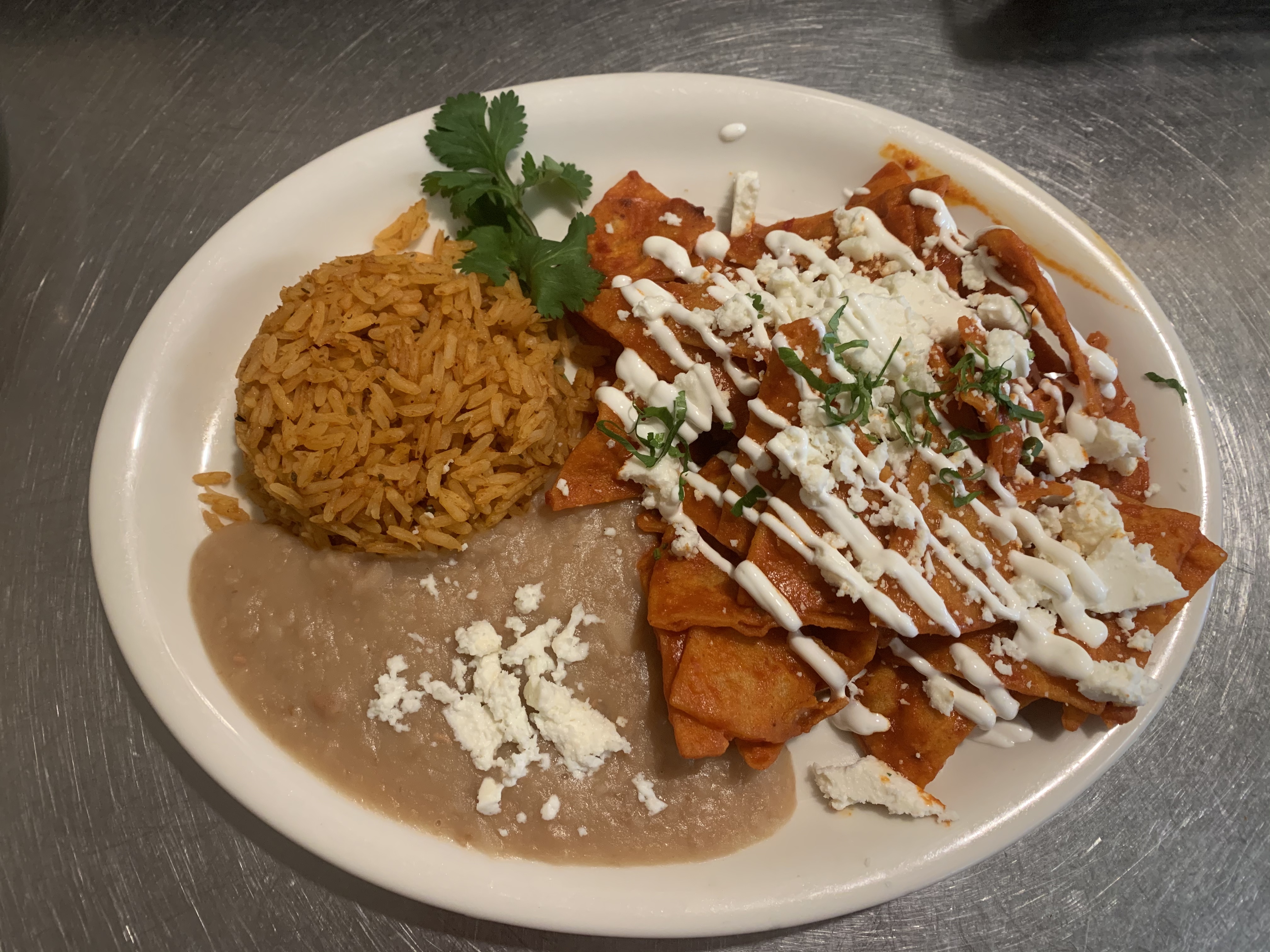Order CHILAQUILES WITH EGGS   RED SAUCE food online from Polaris Street Cafe store, Las Vegas on bringmethat.com