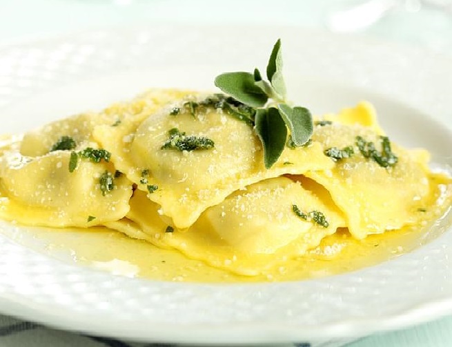 Order Ravioli in butter-sage-Parmigiano cheese sauce food online from Il Baretto store, New York on bringmethat.com