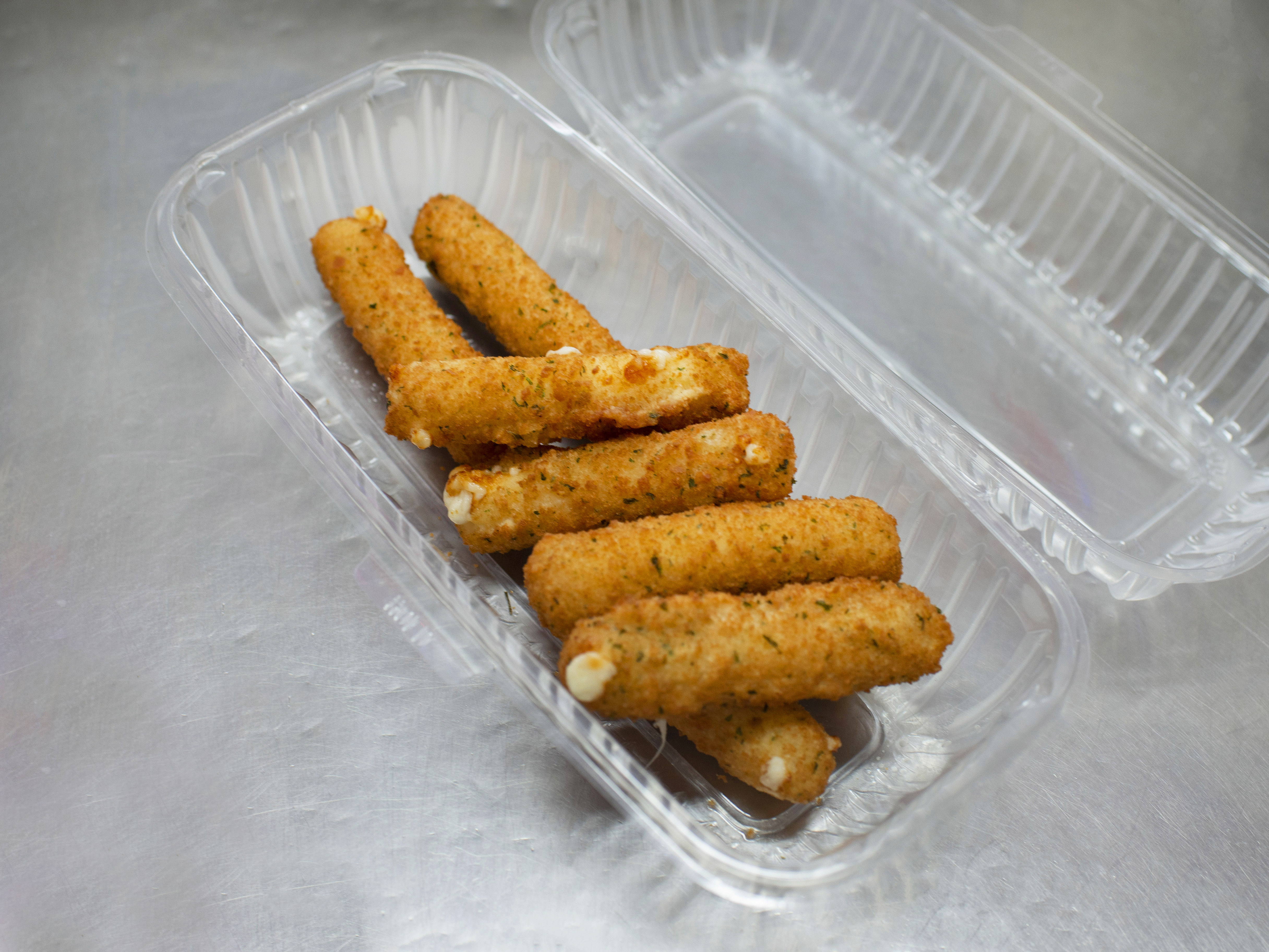 Order 8 Piece Mozzarella Sticks food online from Ray's Candy Store store, New York on bringmethat.com
