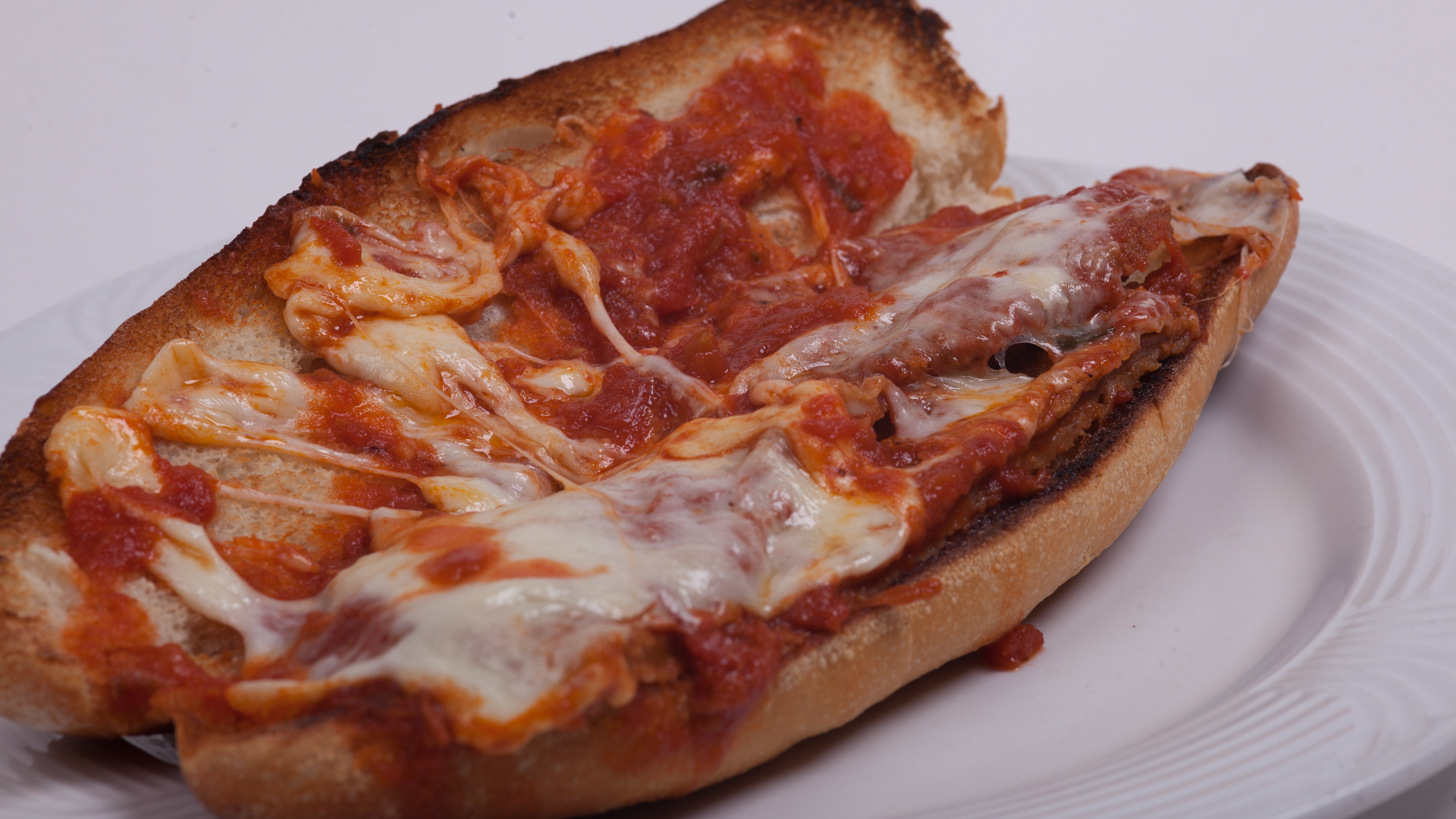 Order Veal Parmigiana Hero food online from Umberto's Pizzeria store, New Hyde Park on bringmethat.com