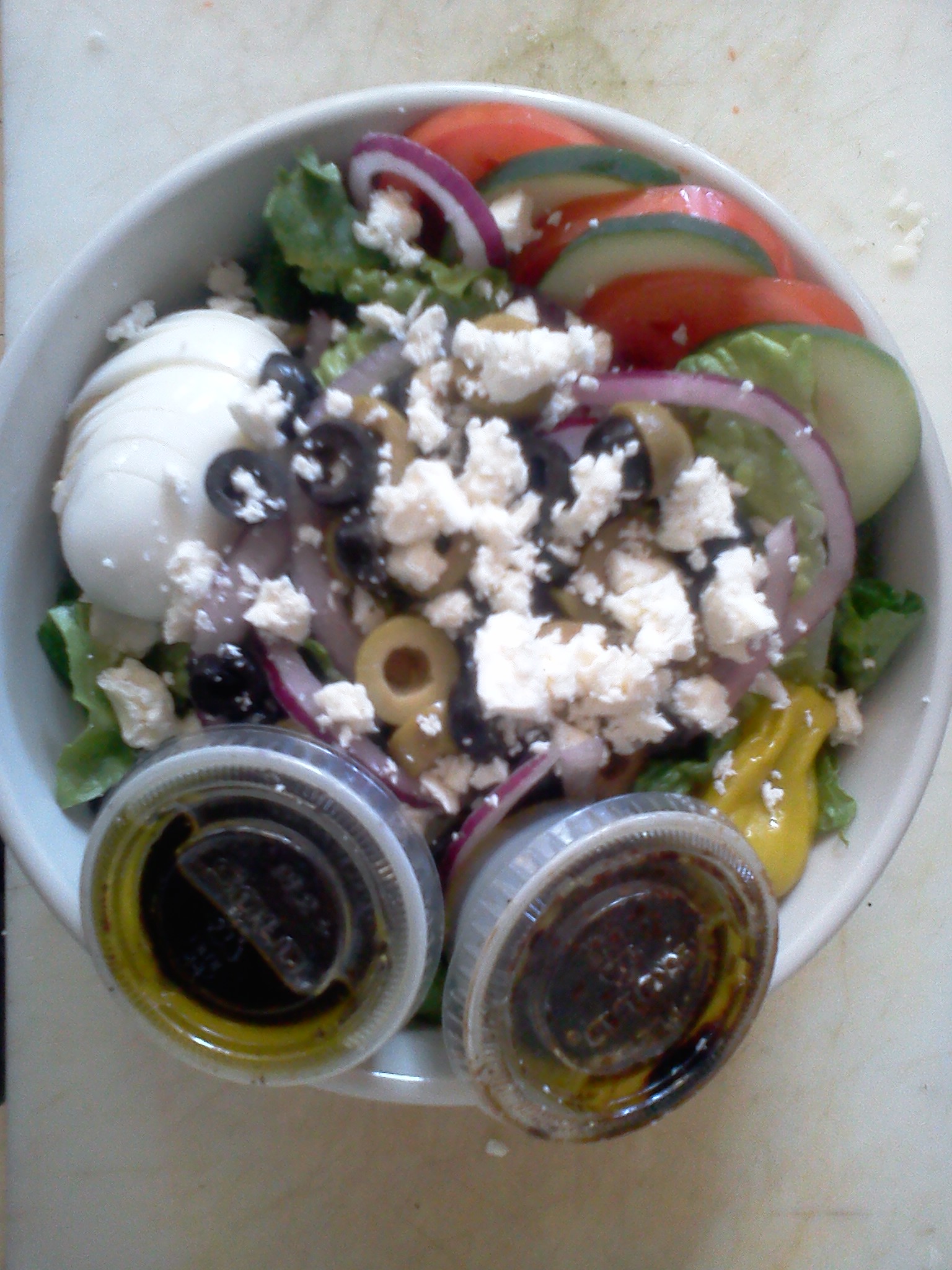Order Greek Salad food online from Mojo Pizza and Pub store, Decatur on bringmethat.com