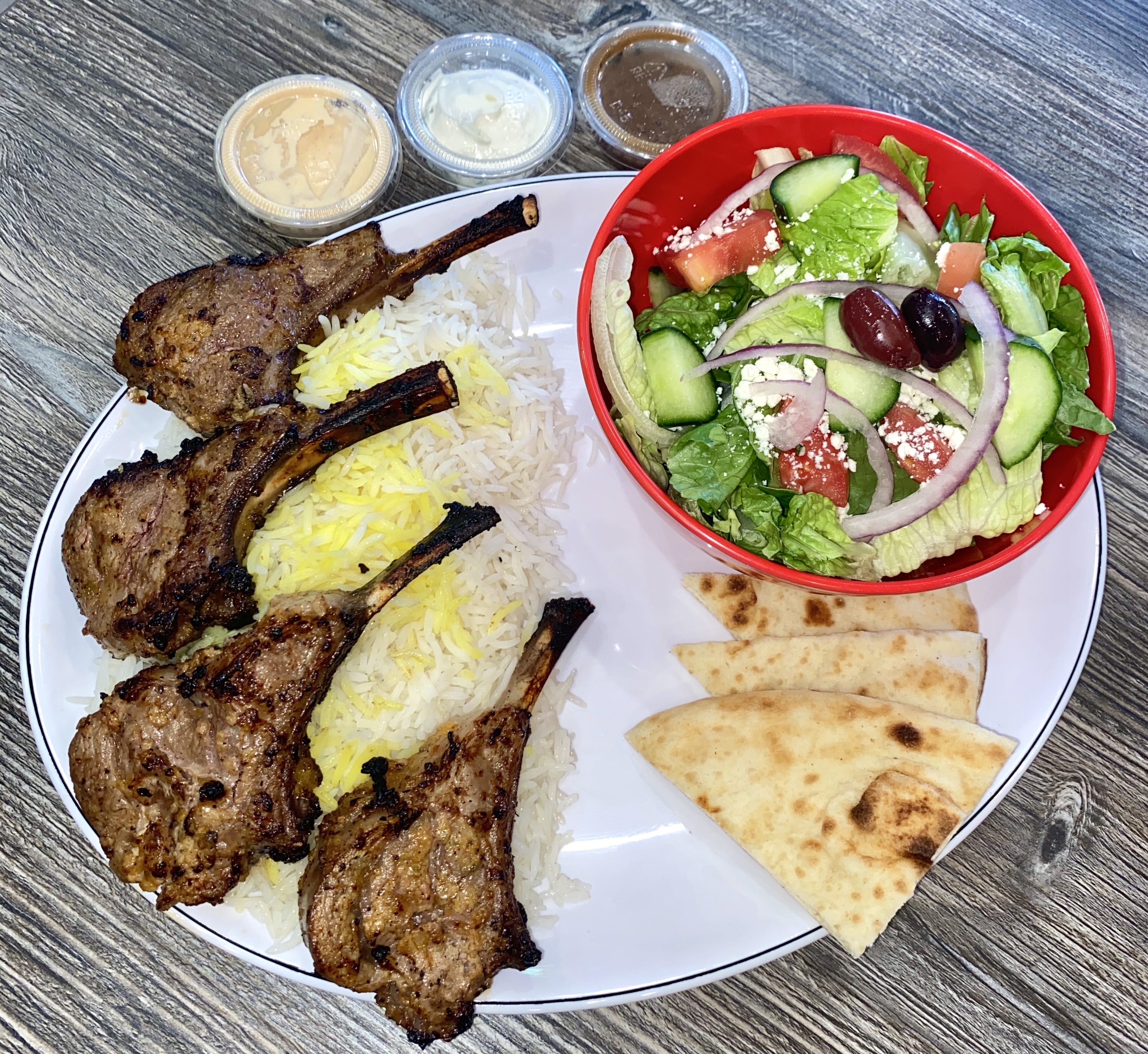 Order Lamb Rack Plate 4 pieces food online from Kabob Cafe store, Foothill Ranch on bringmethat.com