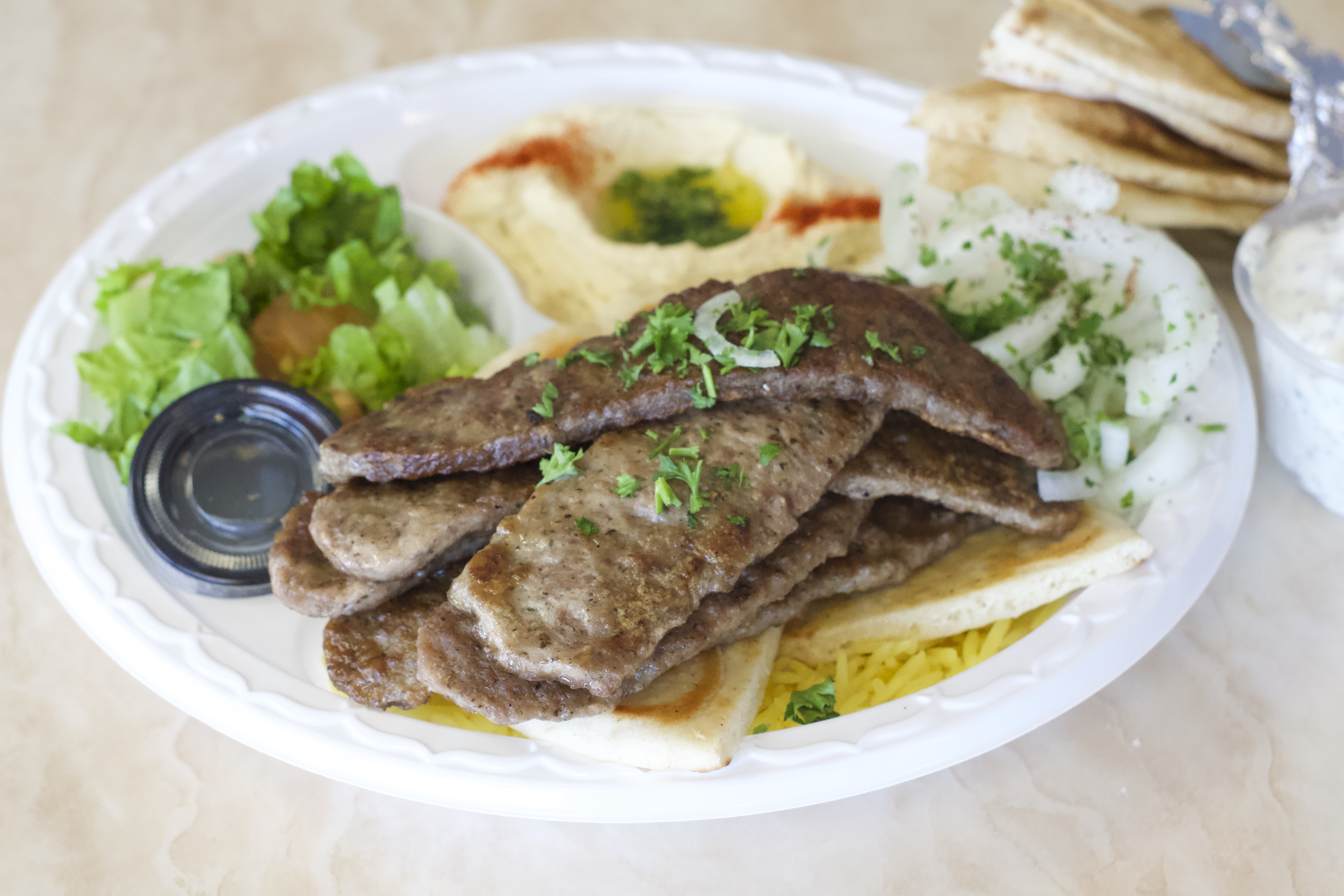 Order Gyro Plate food online from Pita Grill store, Fresno on bringmethat.com
