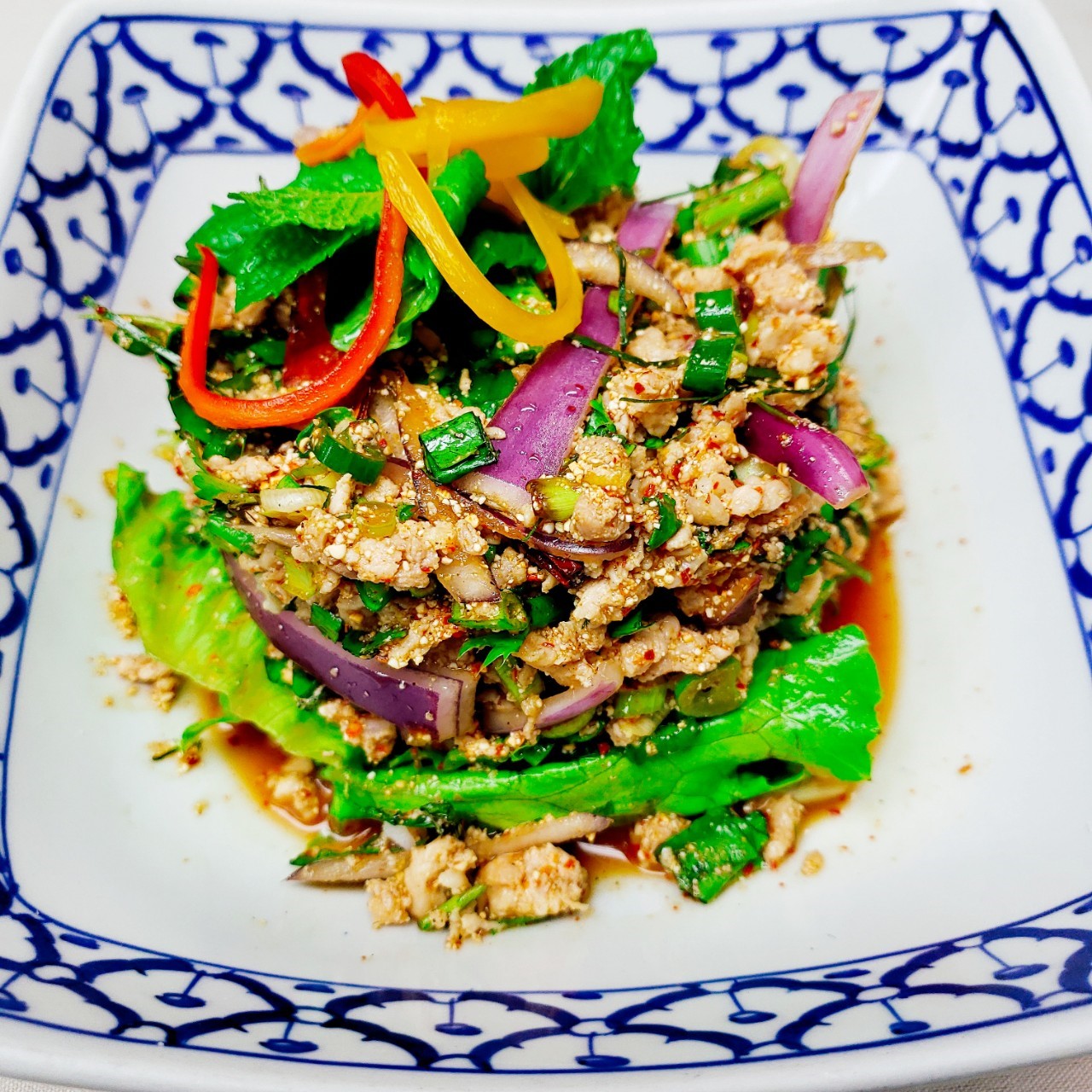 Order Larb Gai food online from Thai Villa store, New York on bringmethat.com