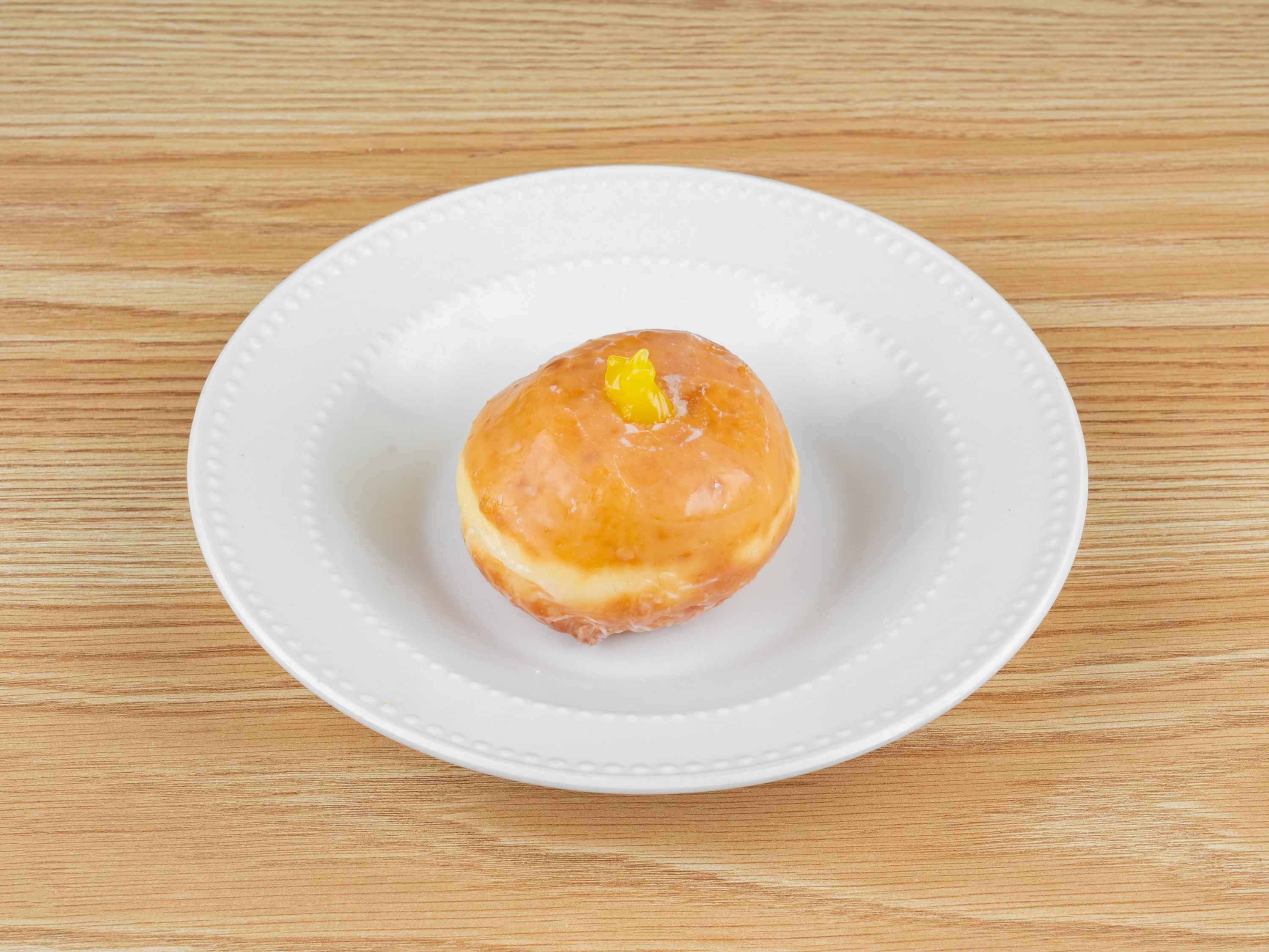 Order Lemon Jelly Fill food online from Goodies Donuts store, Rosharon on bringmethat.com