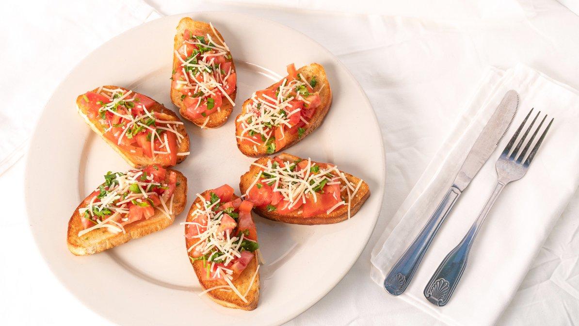 Order Toasted Bruschetta food online from Gondolier Italian Restaurant and Pizza store, Clearwater Beach on bringmethat.com