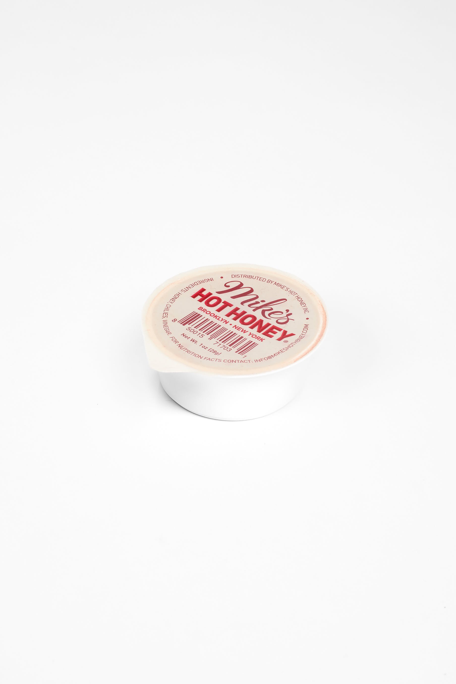 Order Mike’s Hot Honey Dip Cup - 1 oz. food online from Upper Crust Pizza store, Glenshaw on bringmethat.com