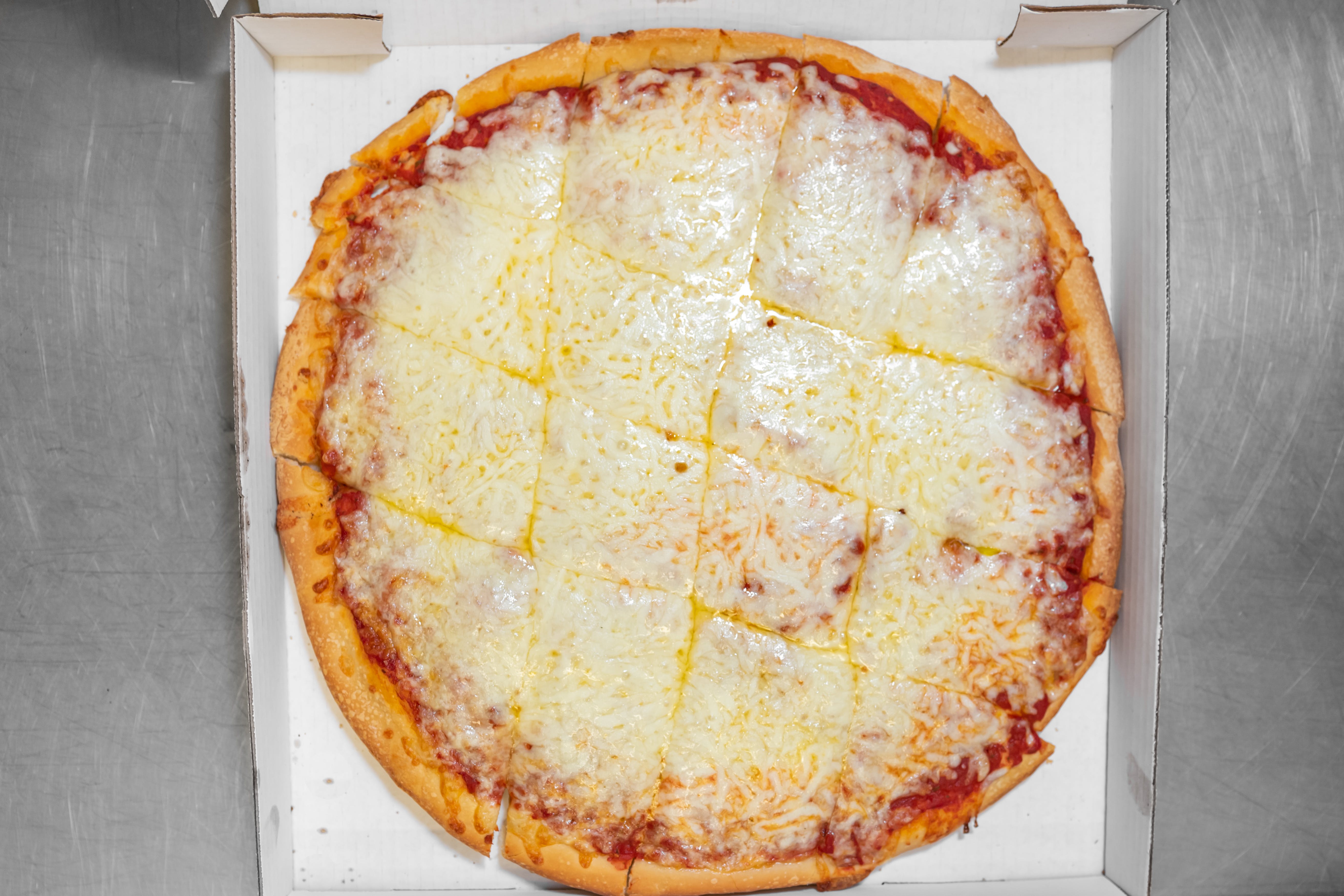 Order 1. Cheese Pizza - Small (8 Slices) food online from Zavarelli's Pizza Shop store, Canton on bringmethat.com