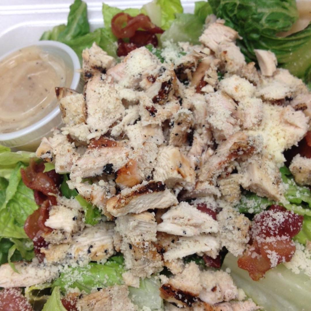 Order Caesar Salad food online from Rhino's Pizzeria store, Webster on bringmethat.com
