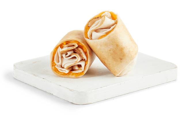 Order TURKEY & CHEDDAR WRAP food online from Tropical Smoothie Cafe store, Snellville on bringmethat.com