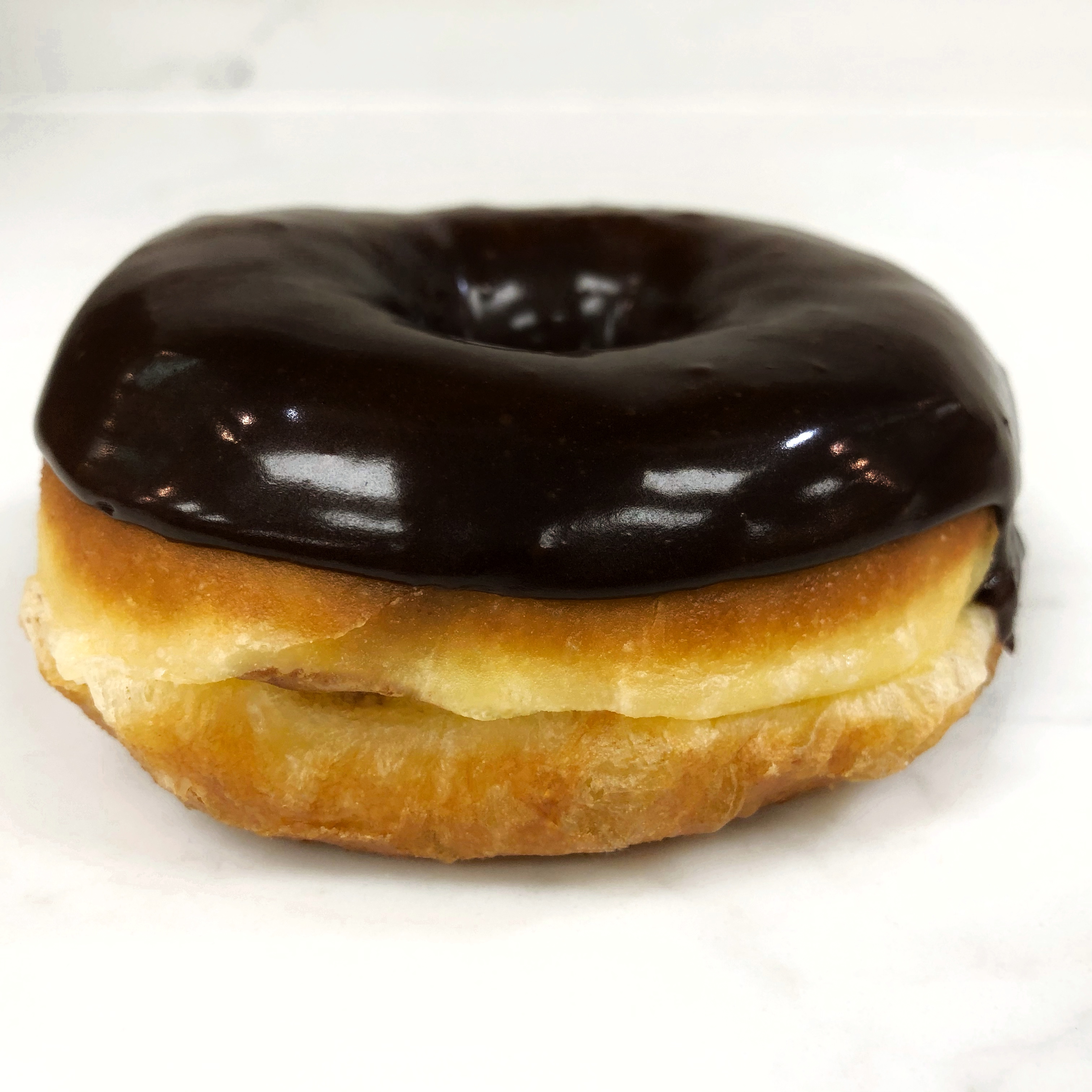 Order Chocolate Raised Donut food online from The Donuttery store, Huntington Beach on bringmethat.com