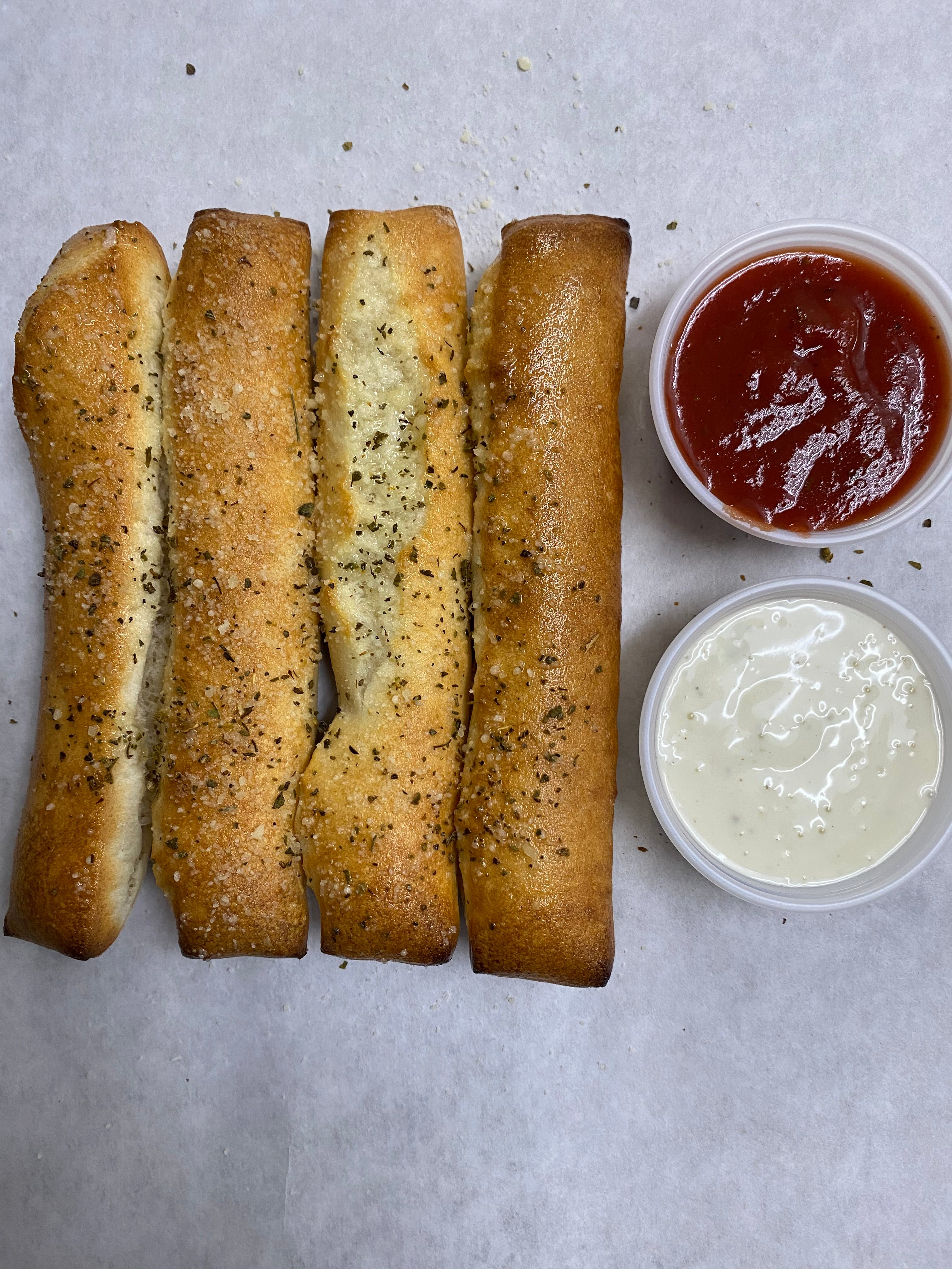 Order Garlic Breadsticks - Small (4 Pieces) food online from Domino's Pizza store, Newark on bringmethat.com