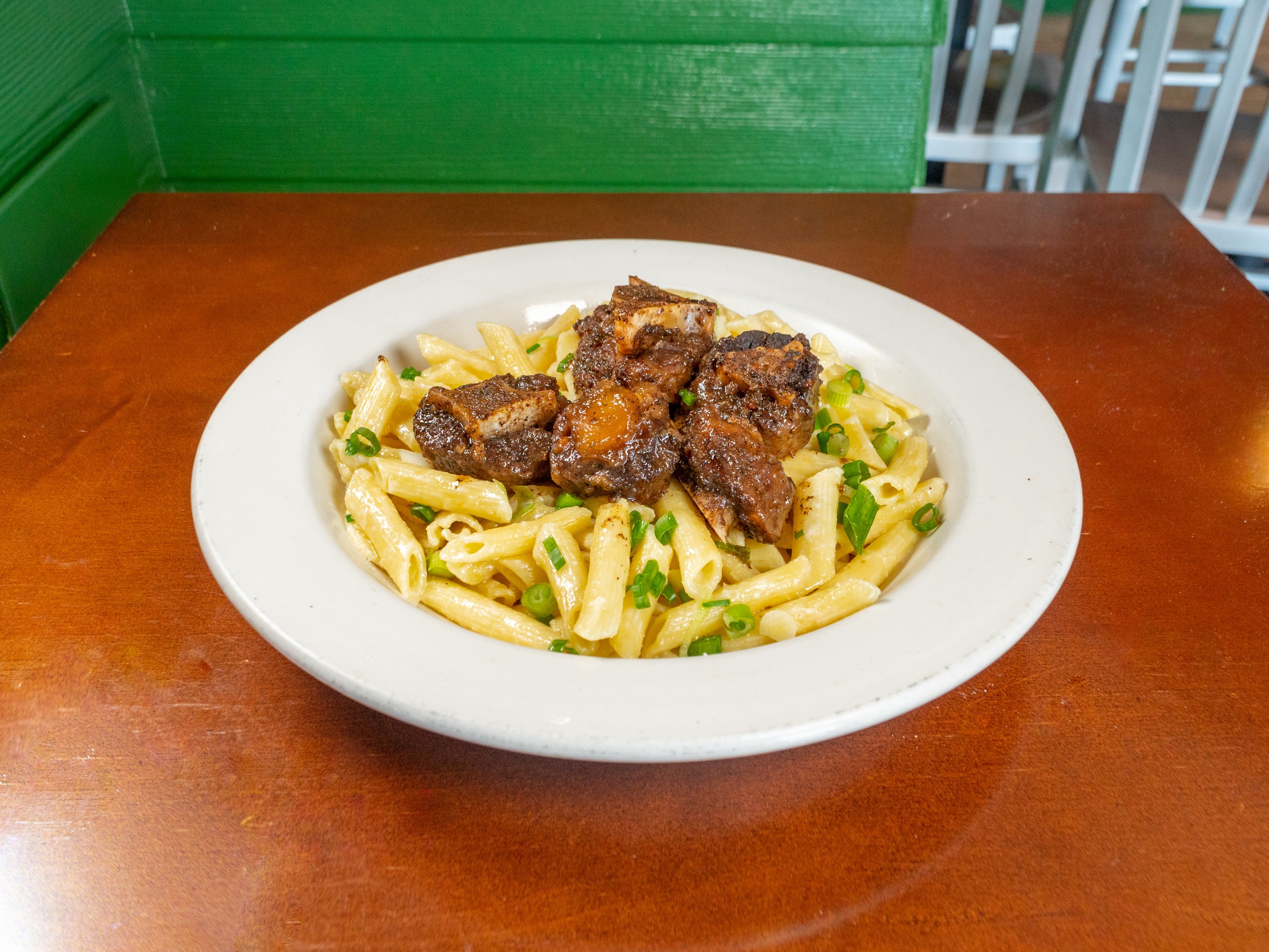 Order Oxtail Pasta food online from Caribbean Plate store, Falls Church on bringmethat.com