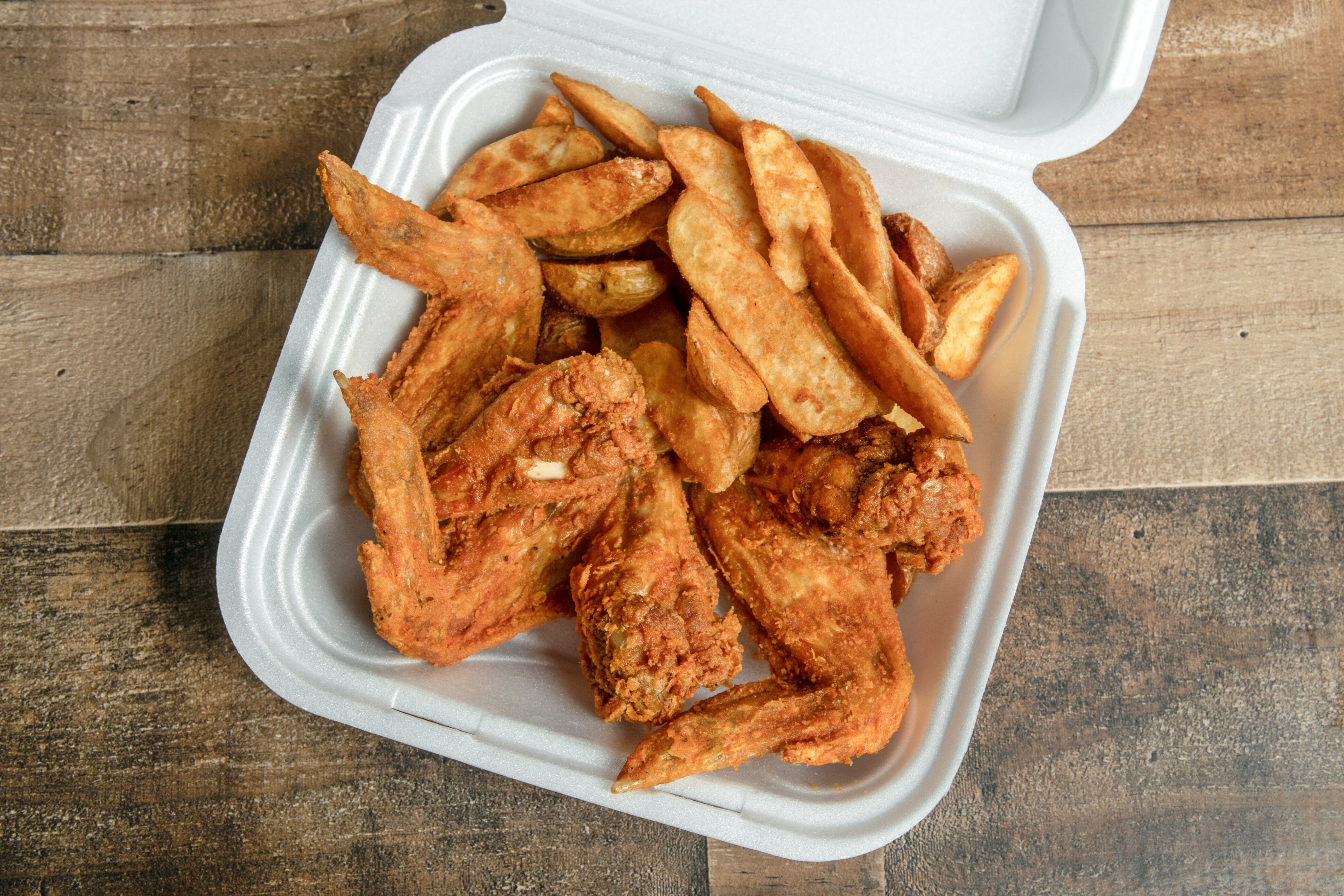 Order 3. Whole Wings, Small Wedges, Can of Pop - Special food online from Mojoes Chicken store, Rochester on bringmethat.com