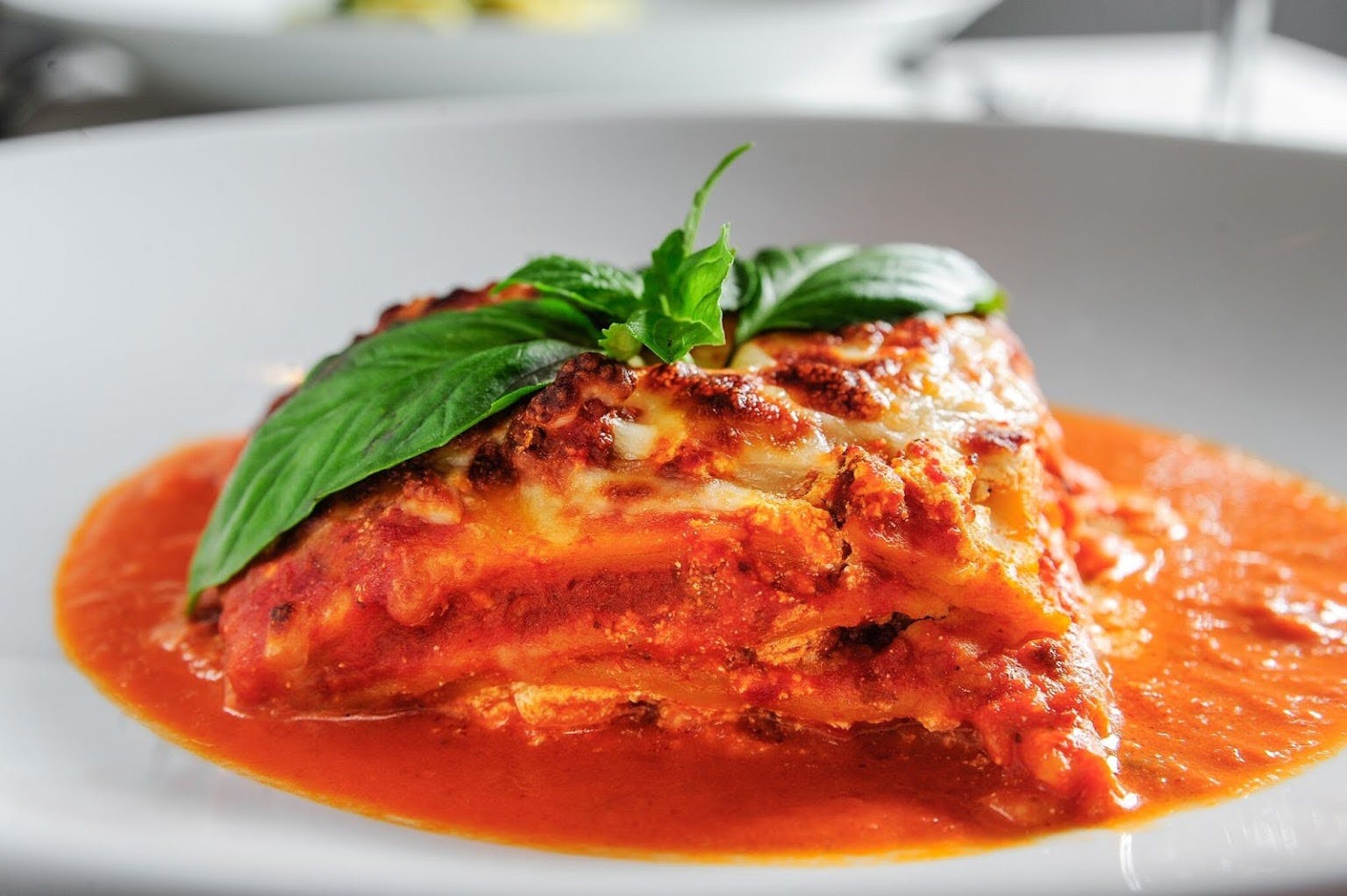 Order Lasagna della Casa - Pasta food online from Cafe Quattro store, Boston on bringmethat.com