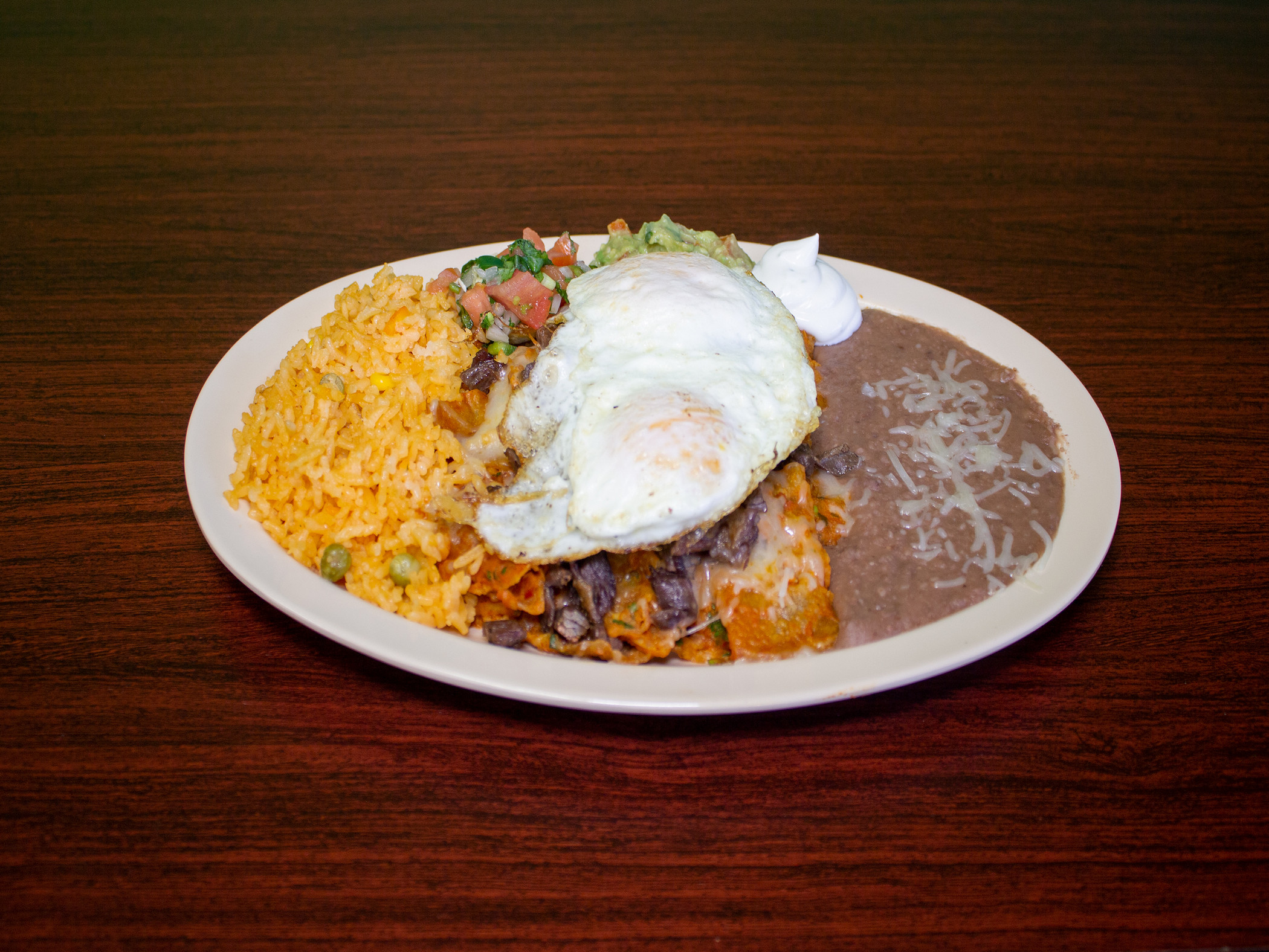 Order Chilaquiles Skillet food online from Marcos Tacos & Catering store, Franklin Park on bringmethat.com
