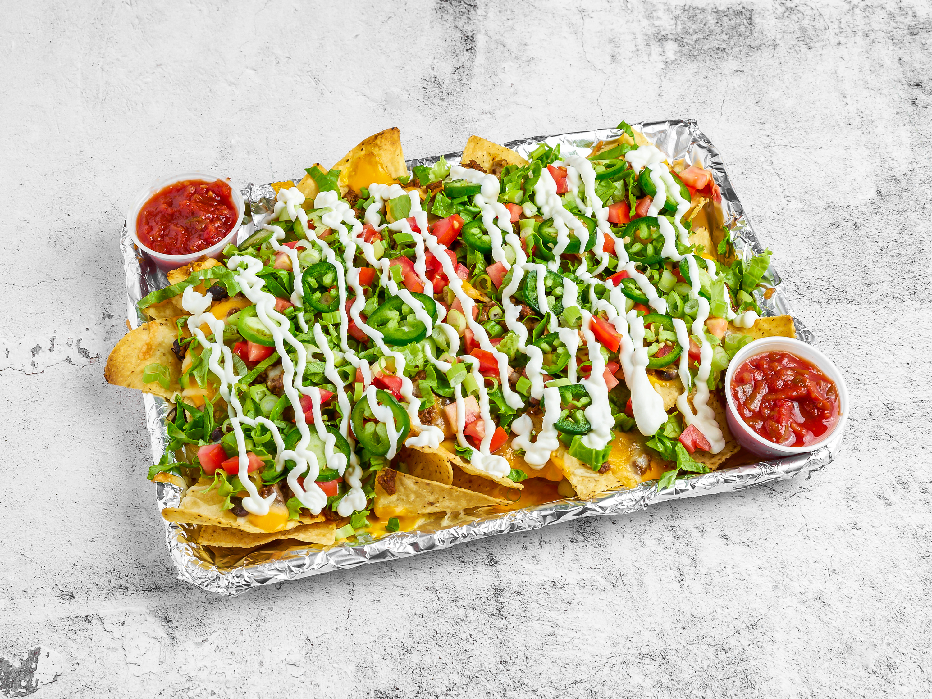 Order Loaded Nachos food online from Tipsy Goat Tavern store, Cary on bringmethat.com