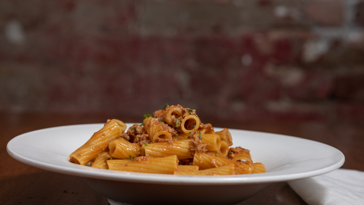 Order Rigatoni alla Bolognese food online from Paul & Jimmy's store, New York on bringmethat.com