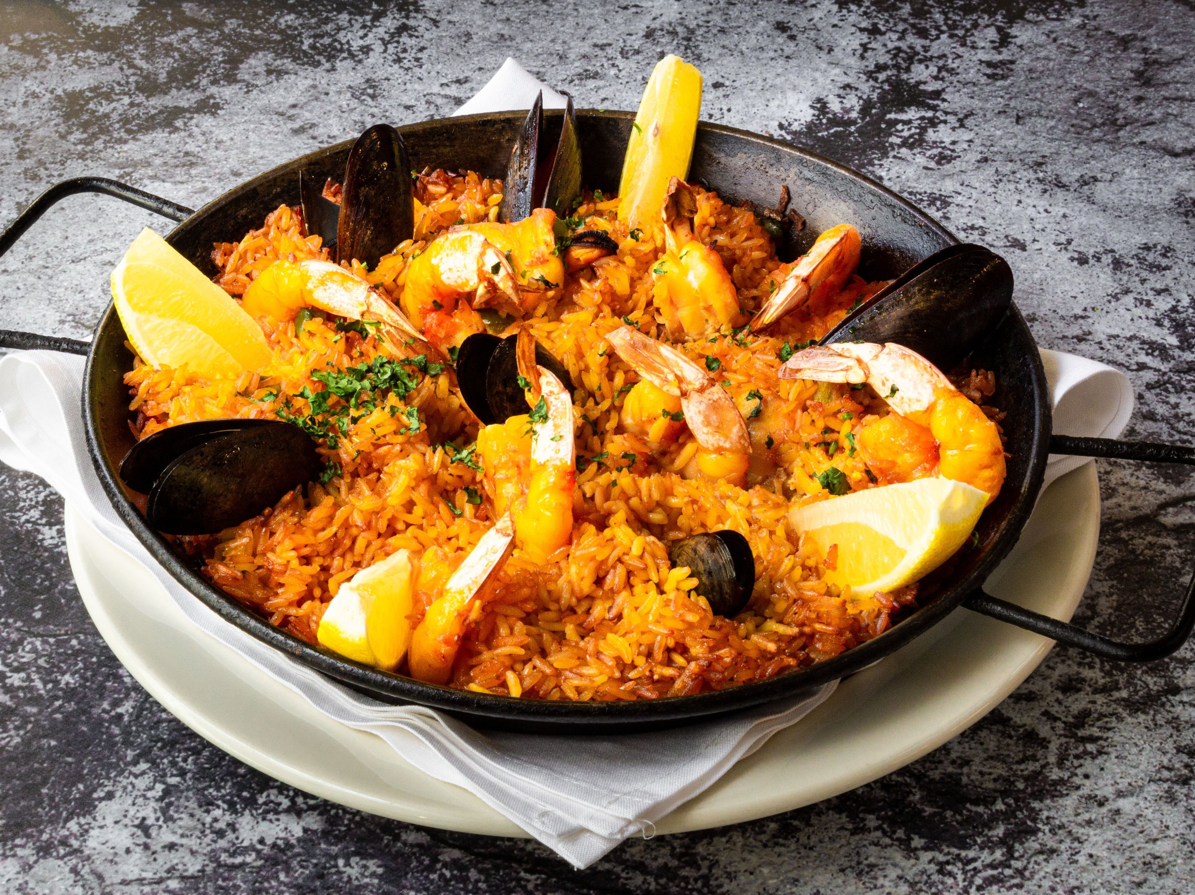 Order Paella de Mariscos FAMILY food online from Antigua Latin Inspired Kitchen store, Milwaukee on bringmethat.com