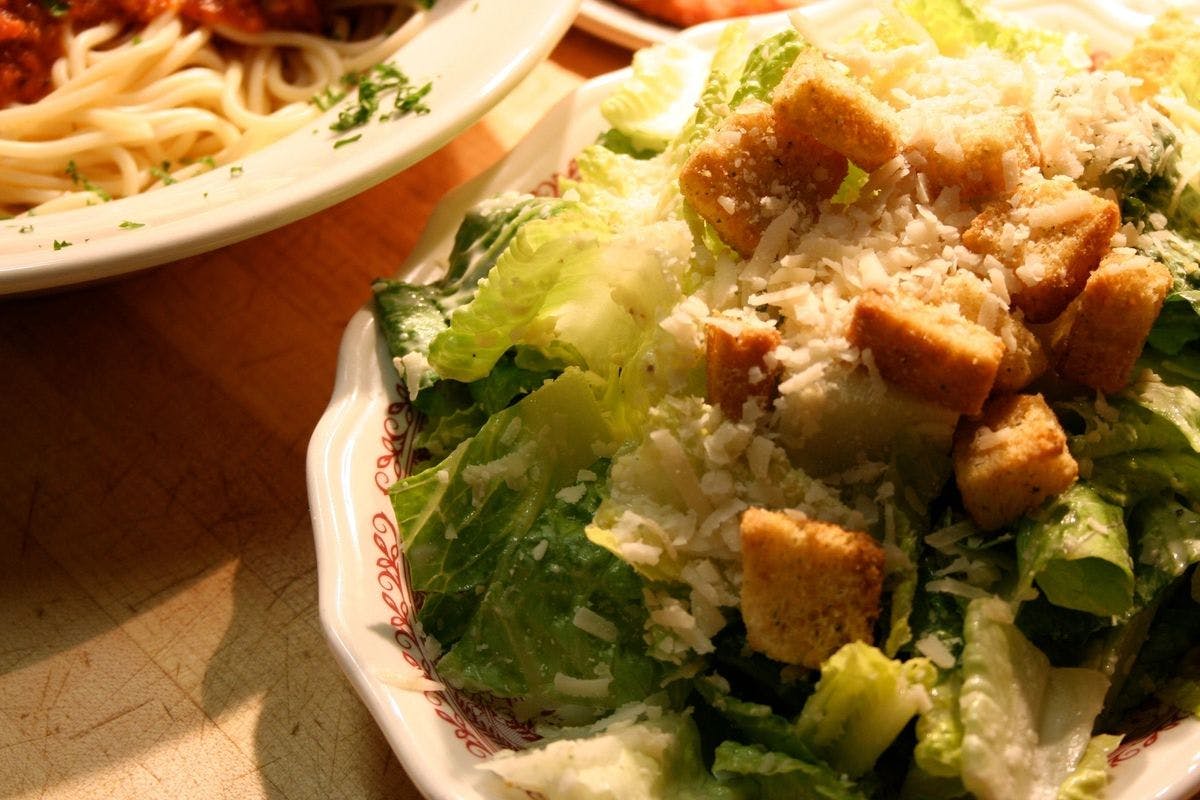 Order Caesar Salad - Salad food online from Fultano's Pizza store, Cannon Beach on bringmethat.com