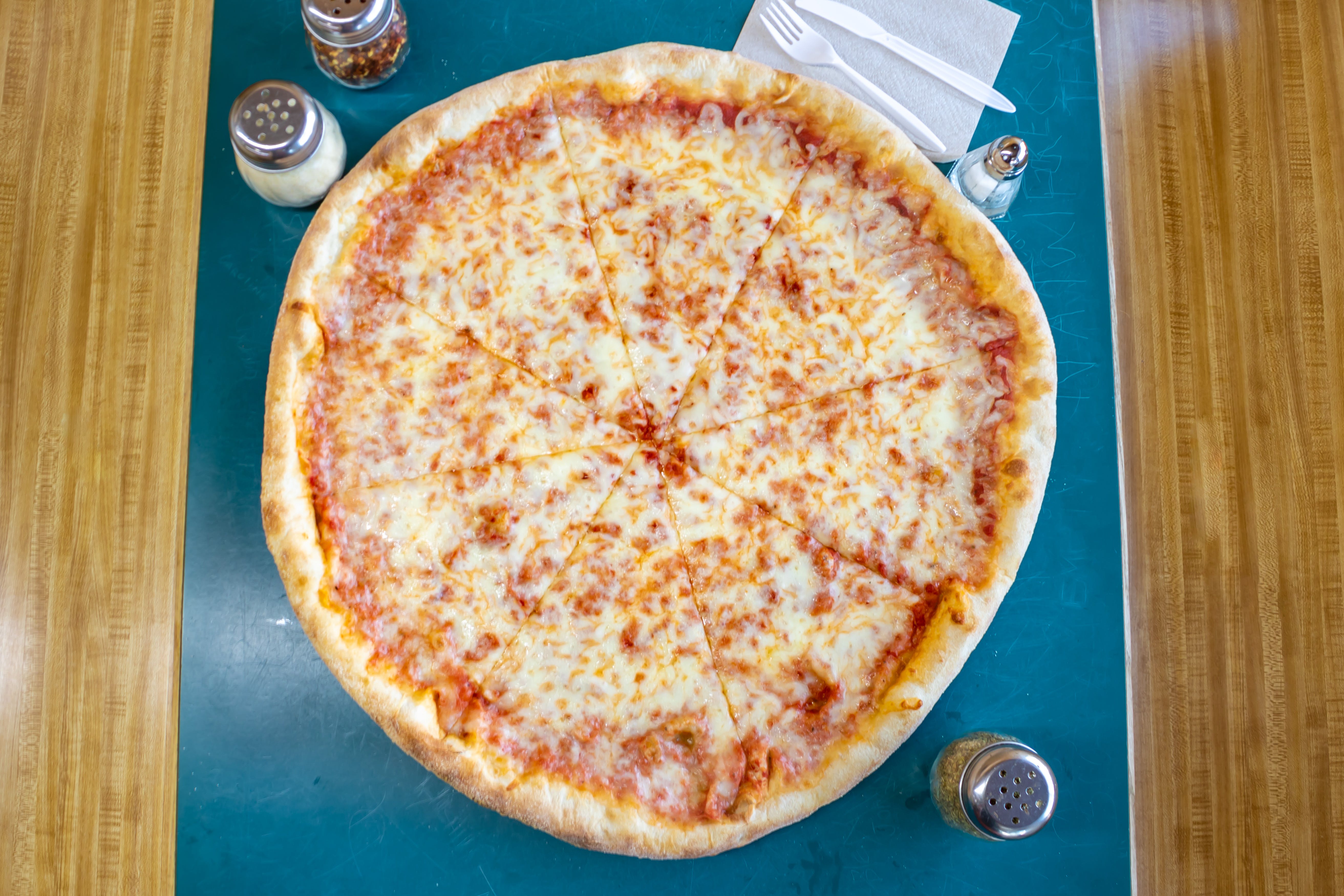 Order Traditional Thin Crust Cheese Pizza - Medium 14" (6 Slices) food online from T J's Pizza & Pasta store, Lawrence on bringmethat.com