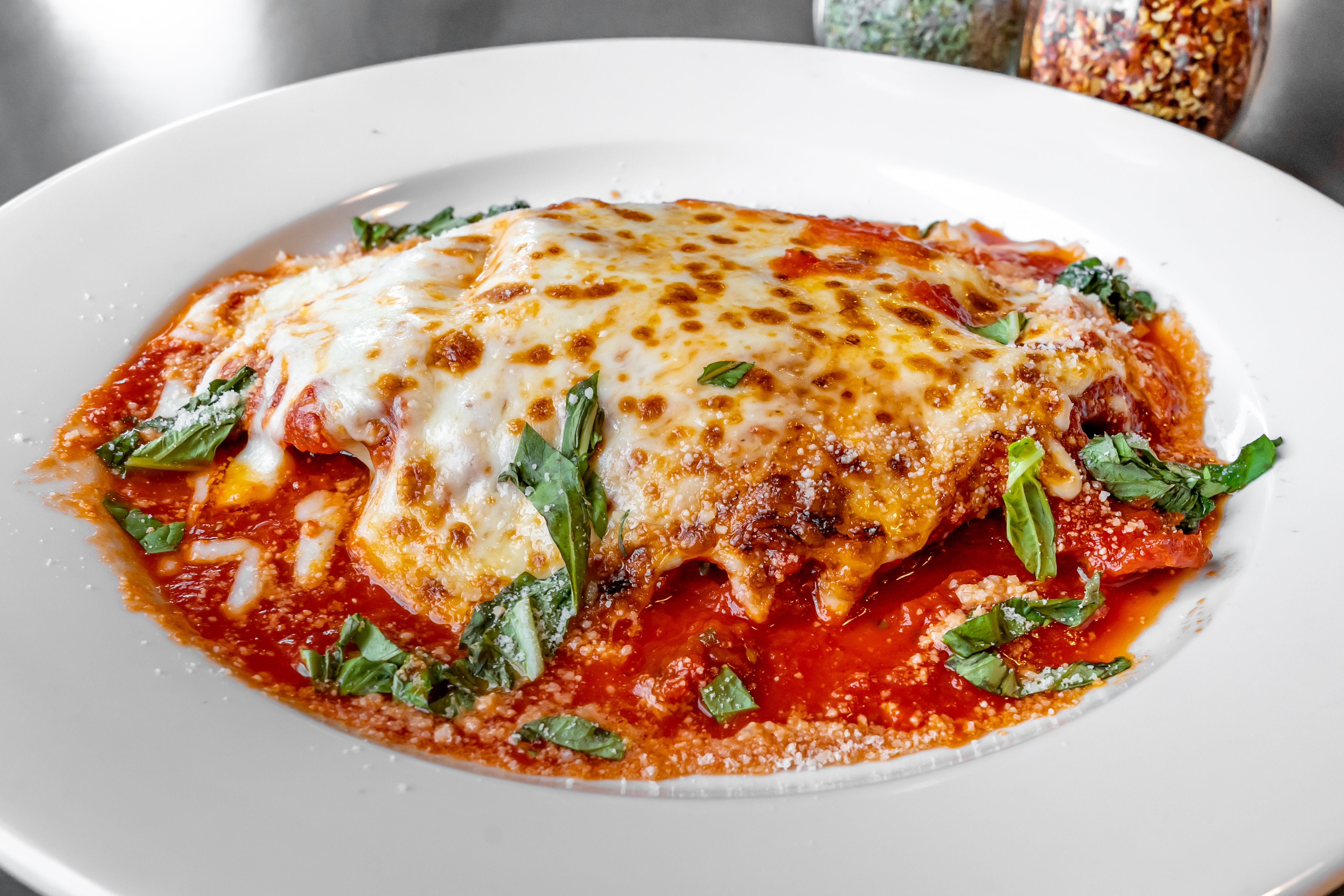 Order Chicken Parmigiana - Entree food online from Gino Parlor Of Sandy Hook store, Sandy Hook on bringmethat.com