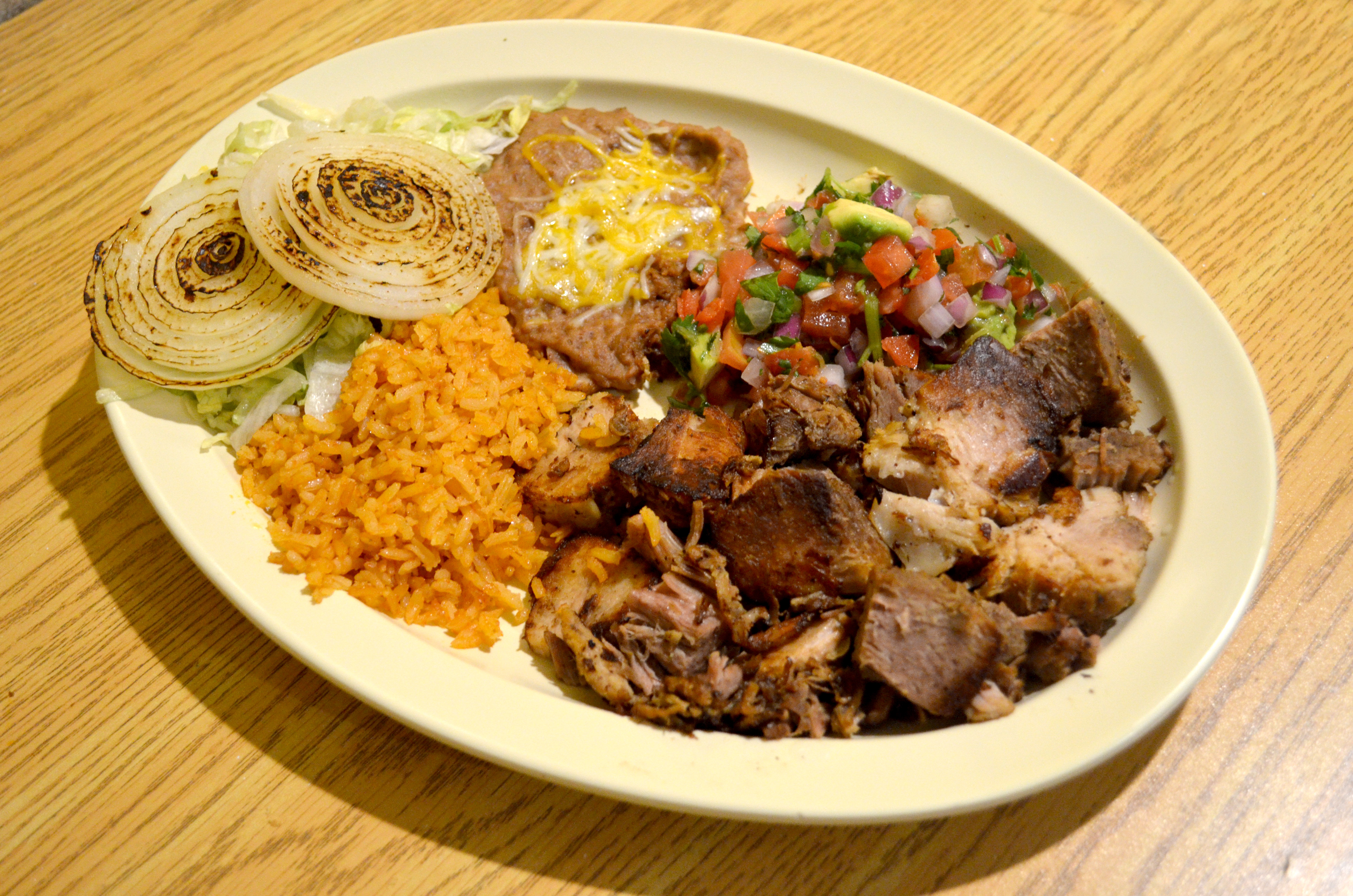 Order #22. Carnitas Dinner Plate food online from El Tapatio Restaurant store, Muskegon on bringmethat.com