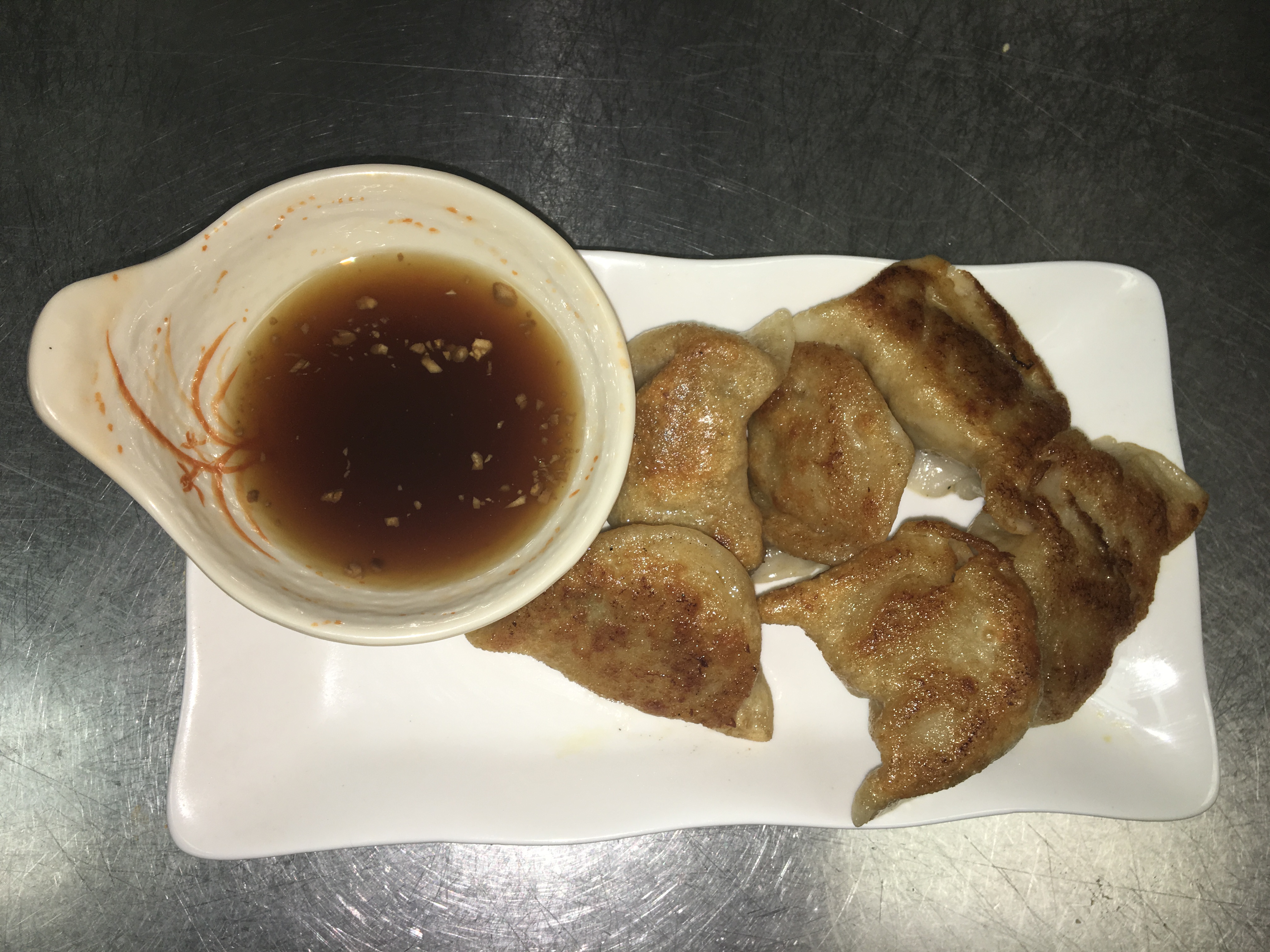 Order B6. Pan-Fried Pork Dumplings 锅贴（8） food online from Red Chili store, Syracuse on bringmethat.com