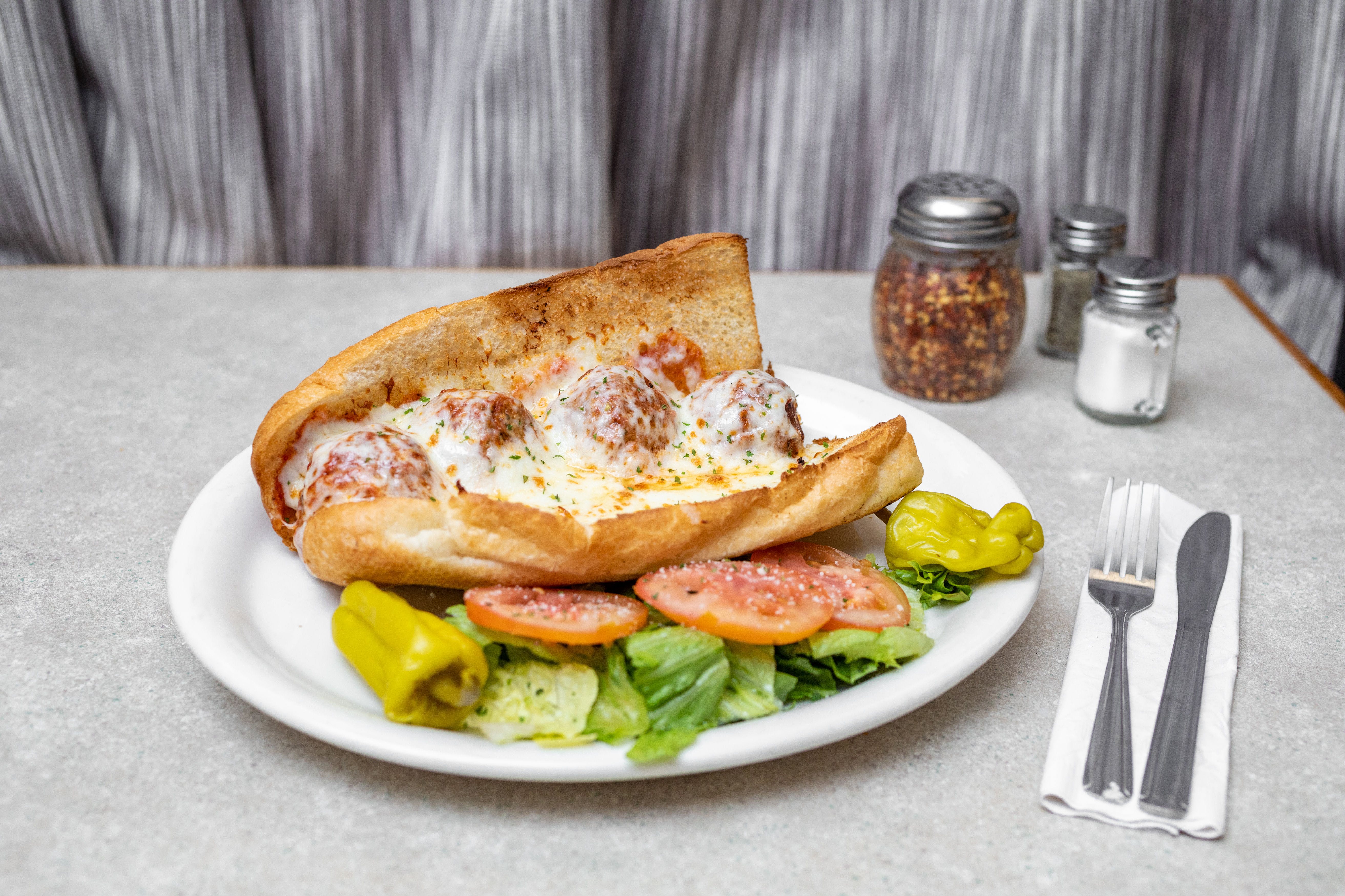 Order Homemade Meatball Sandwich - Sandwich food online from Saucy's Pizza store, Littleton on bringmethat.com