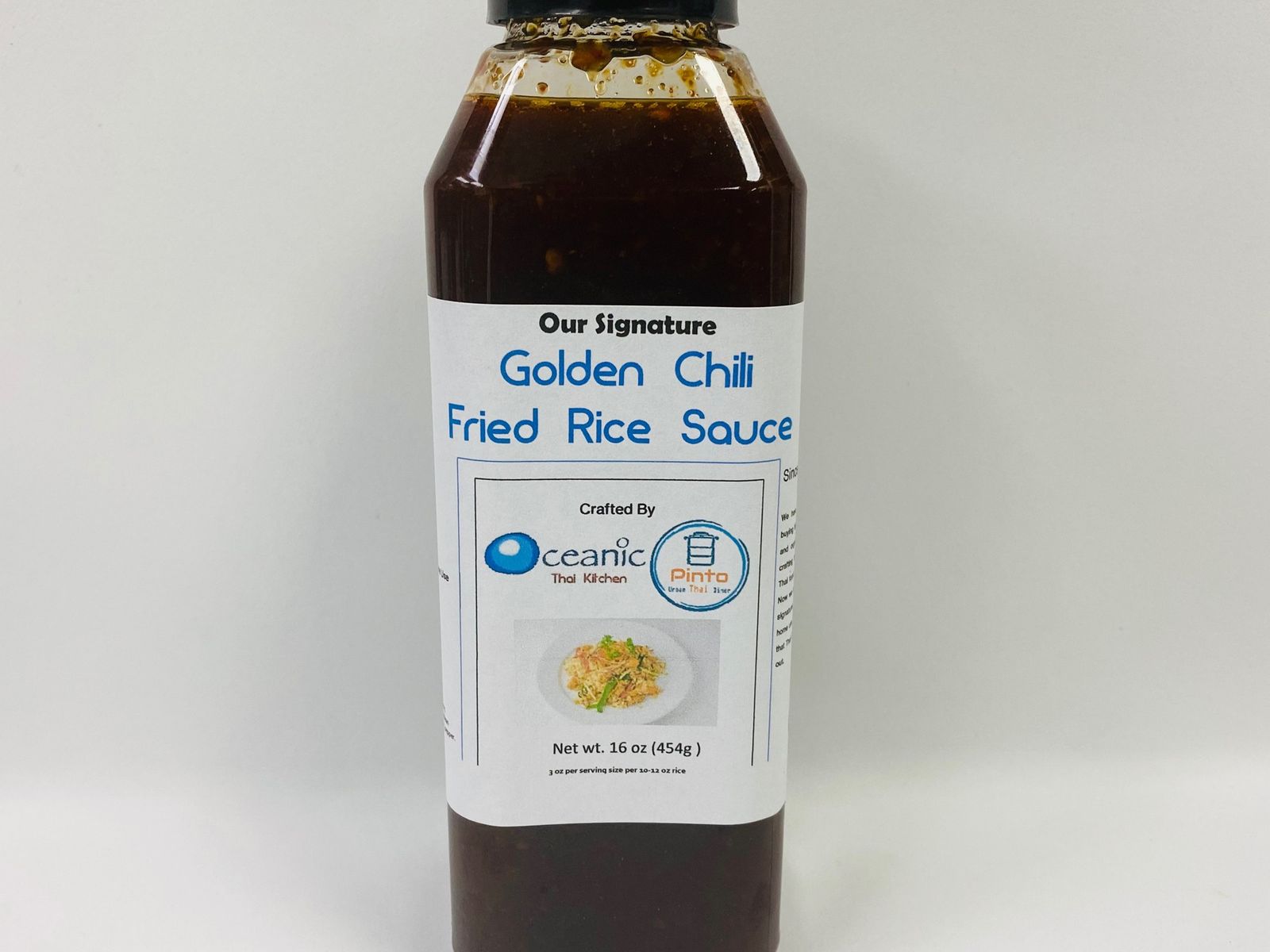 Order Bottled Golden Chili Fried Rice Sauce food online from Pinto Urban Thai Diner store, Richardson on bringmethat.com
