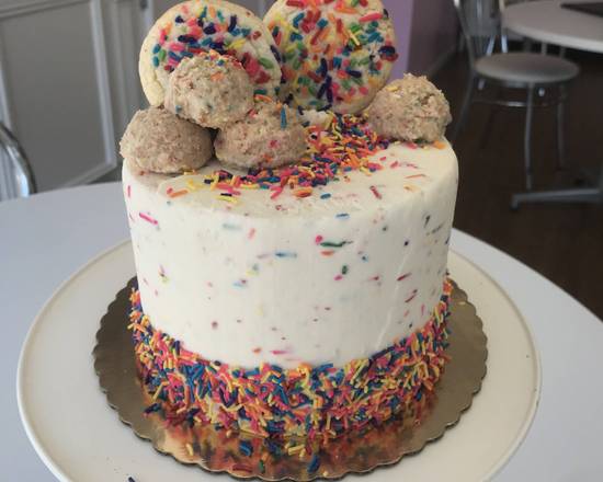 Order Piñata Confetti Cake food online from Caked Up Cafe store, New City on bringmethat.com