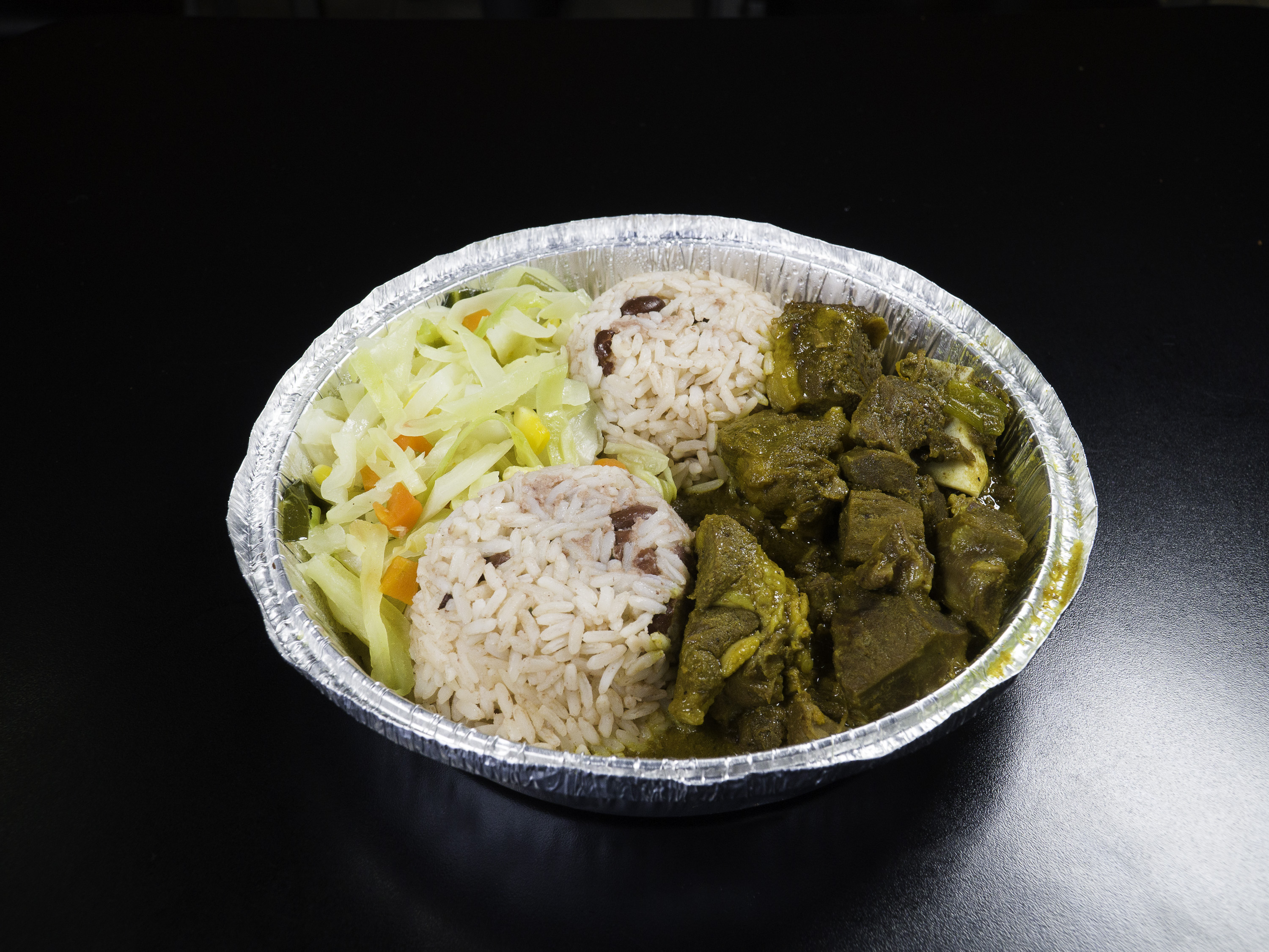 Order Small Curried Goat food online from Tropicana Eatery store, Silver Spring on bringmethat.com