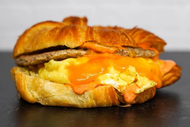 Order Croissant, Sausage, Egg & Cheddar food online from Neighborhood Cafe store, Hopewell on bringmethat.com