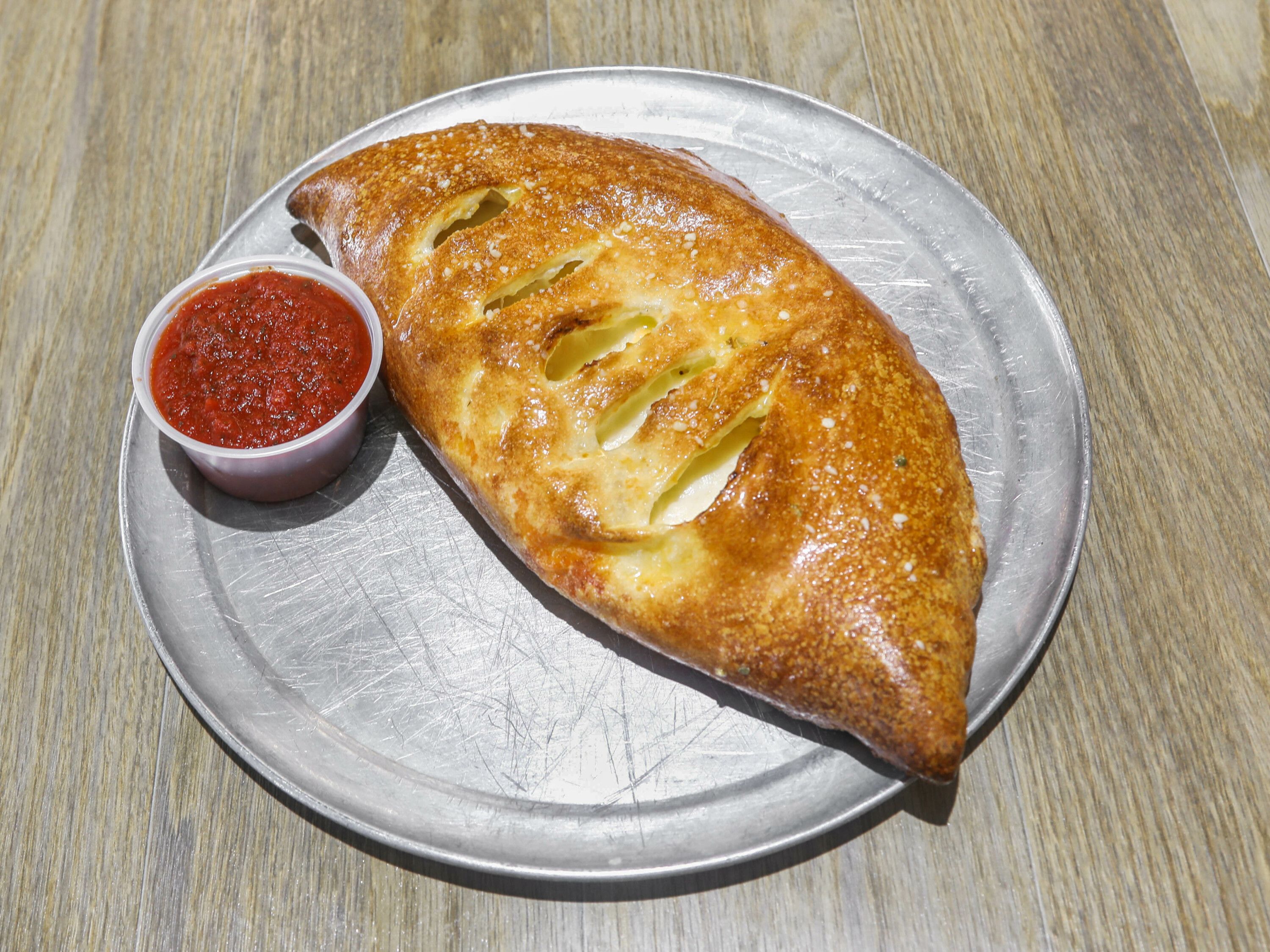 Order Dave's Special Calzone food online from Milania's NY Pizza store, Adairsville on bringmethat.com