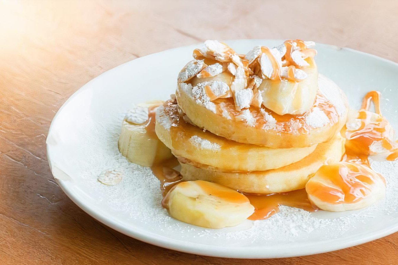 Order Banana Pancakes (3) food online from Sinbad Cafe & Grill store, Secaucus on bringmethat.com