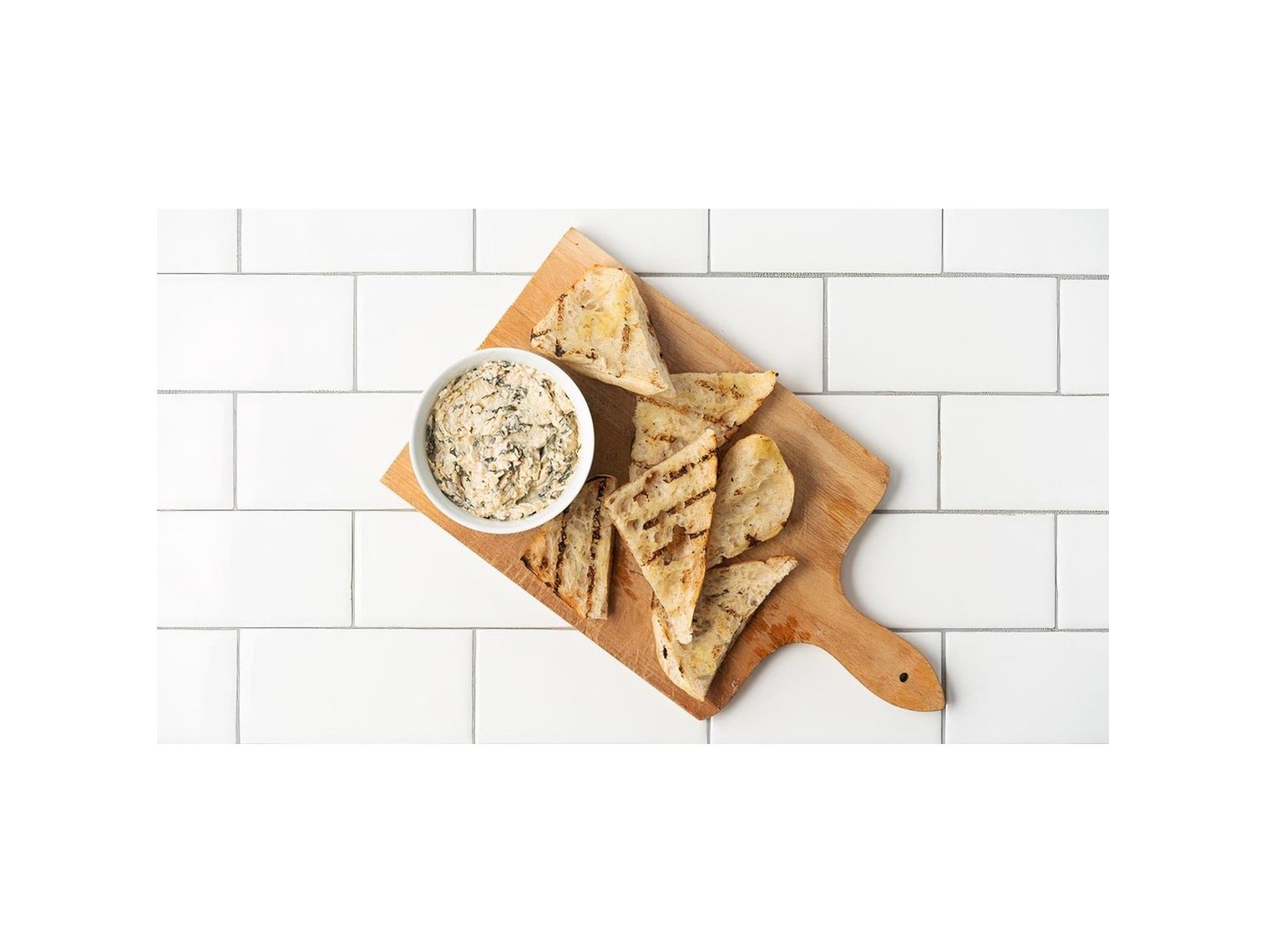 Order Roasted Artichoke-Spinach Spread with Bruschetta food online from Pastini  store, Portland on bringmethat.com
