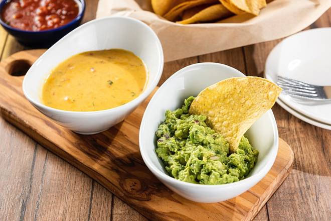 Order Guac/Queso Duo food online from On The Border store, Hunter Mill on bringmethat.com
