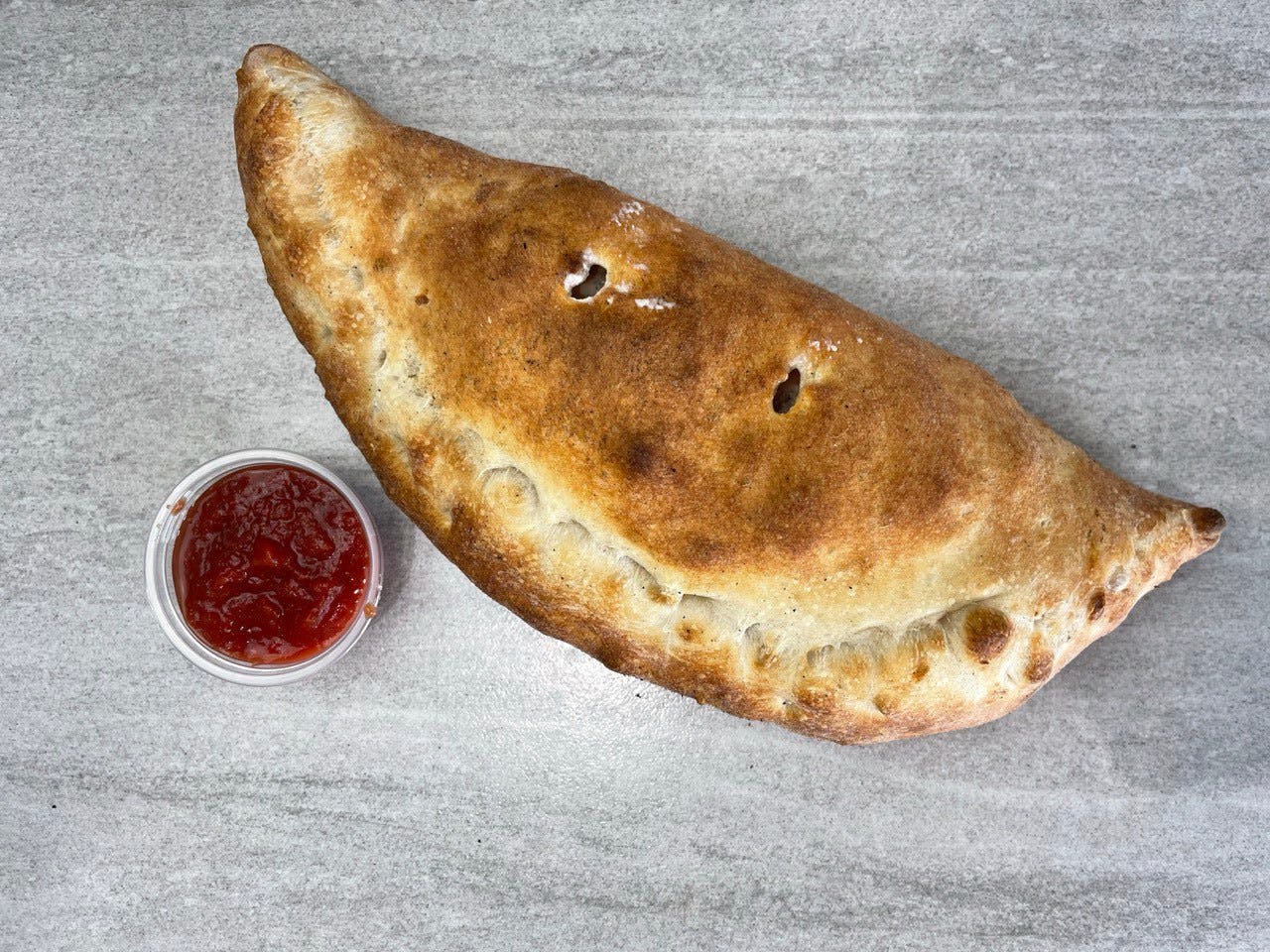 Order Three Toppings Calzone - Calzone food online from Troys Italian Kitchen store, Arlington on bringmethat.com