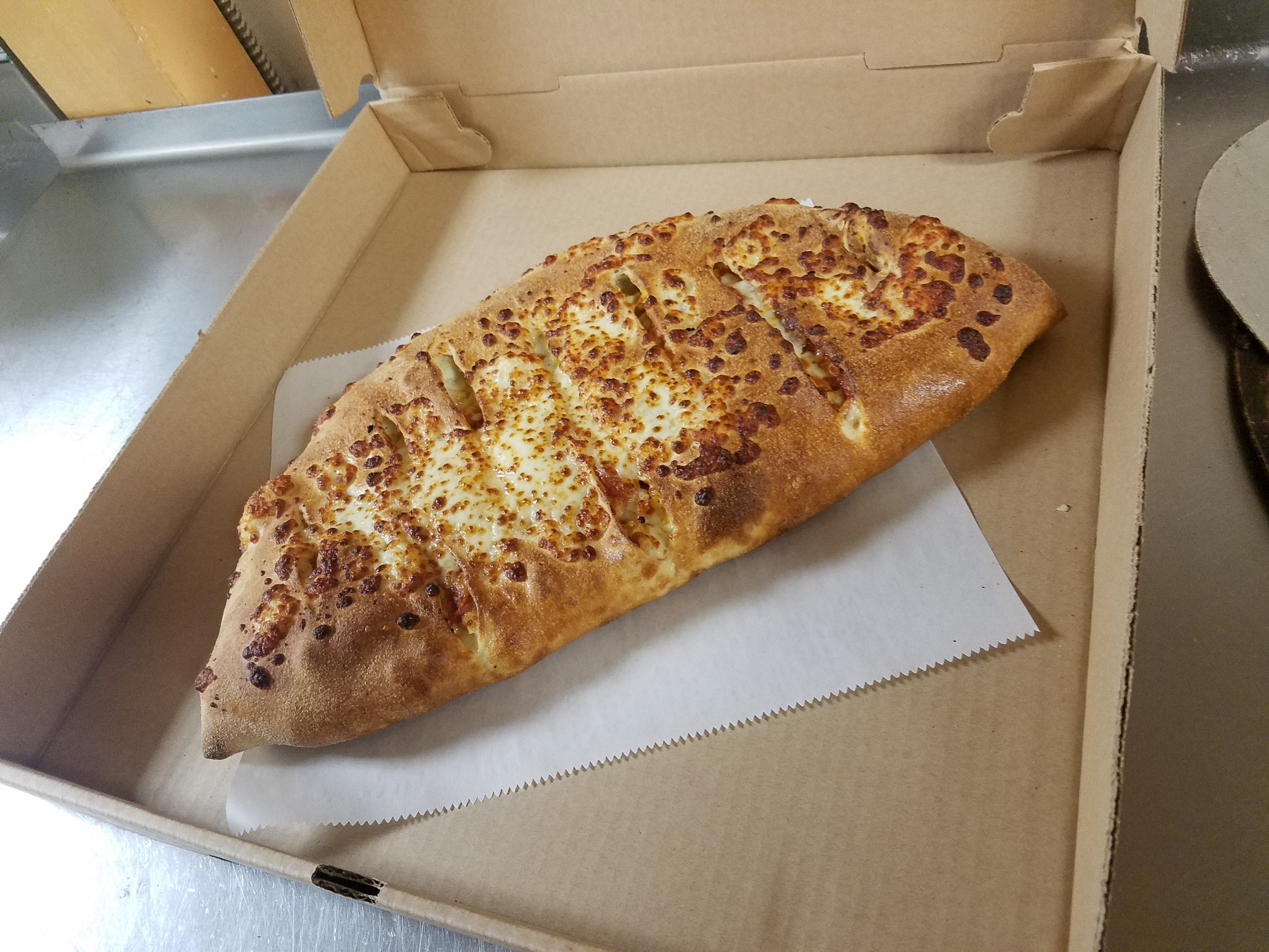 Order Chicken Parmesan Calzone food online from Gregory House Of Pizza store, Belmont on bringmethat.com