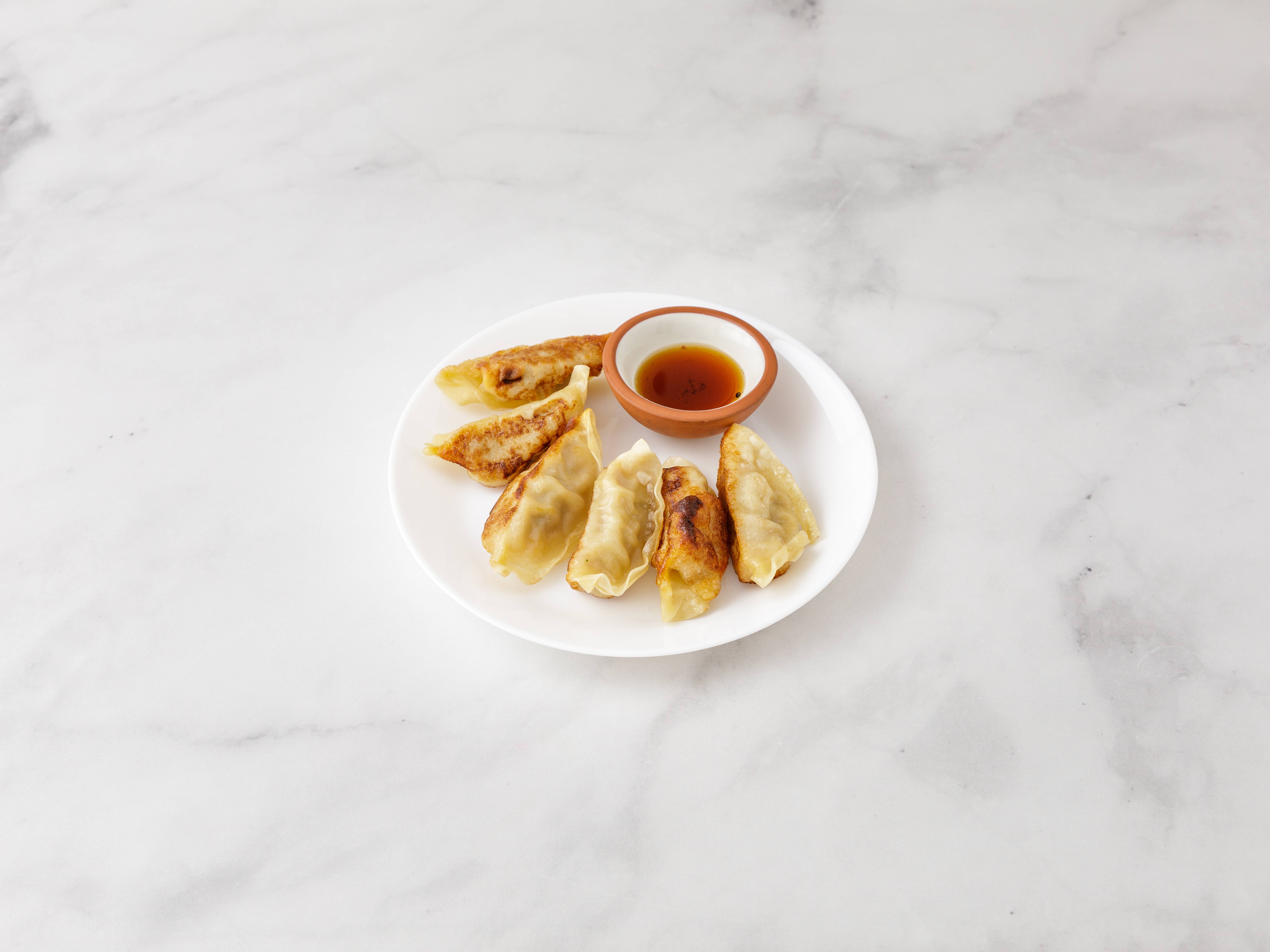 Order Gyoza food online from Umi Japanese Restaurant store, Forest Hills on bringmethat.com