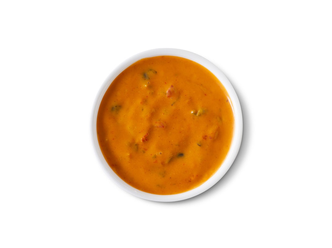 Order Side of Queso Diablo food online from Qdoba Mexican Eats store, Knightdale on bringmethat.com