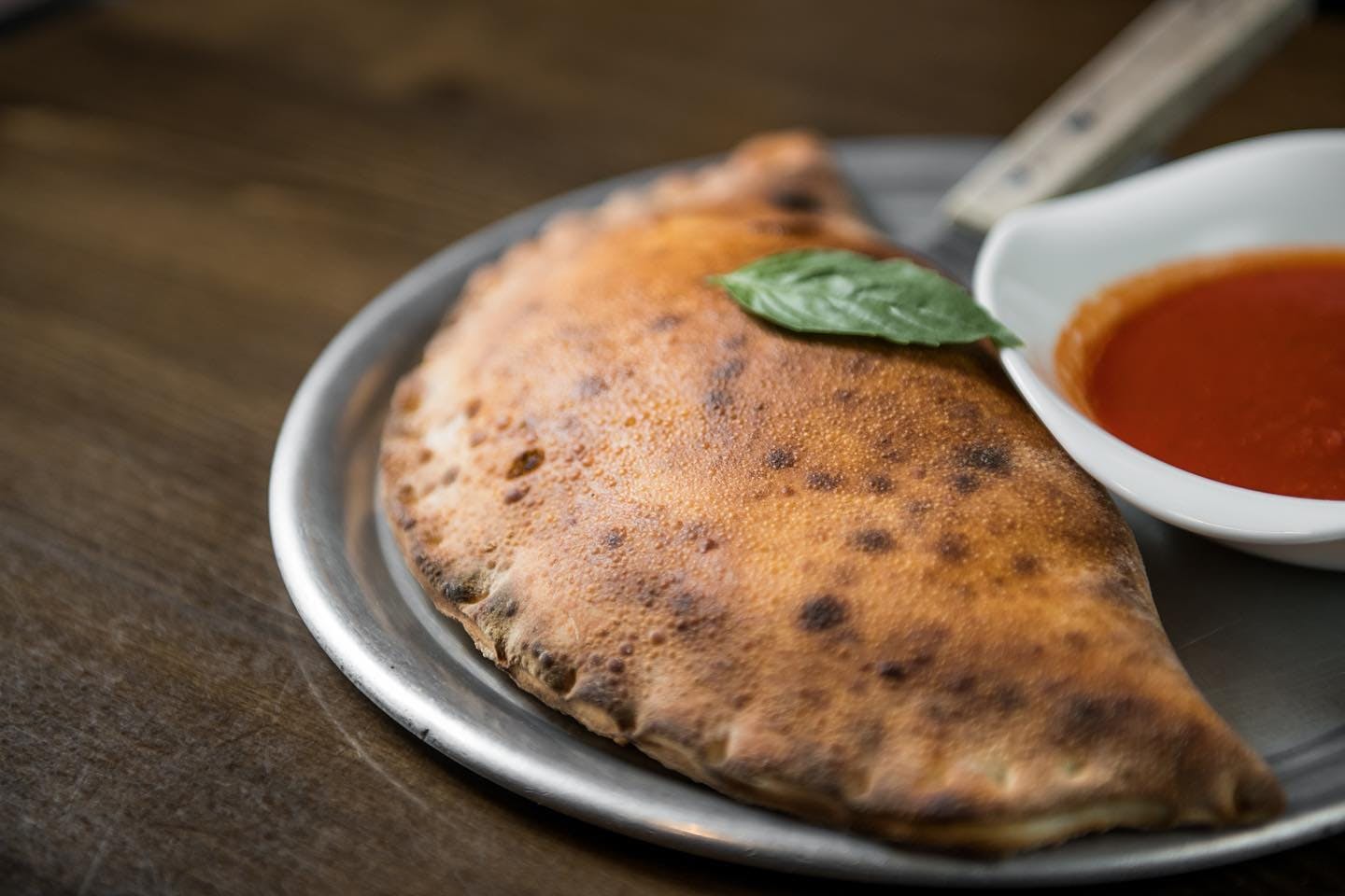 Order Four Cheese Calzone - Calzone food online from Table 87 Coal Oven Pizza store, Brooklyn on bringmethat.com