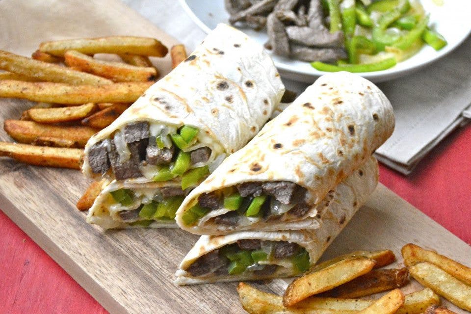 Order Philly Cheesesteak Wrap - Wrap food online from Carini's Pizza Restaurant store, Mahanoy City on bringmethat.com