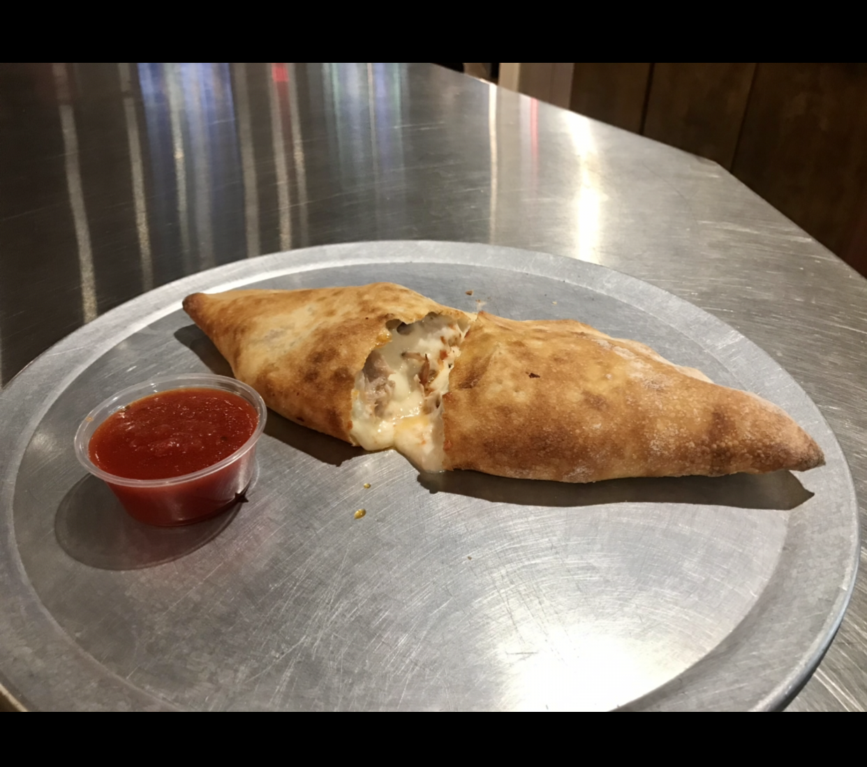 Order Classic Calzone food online from Johnny's Pizza store, Cary on bringmethat.com