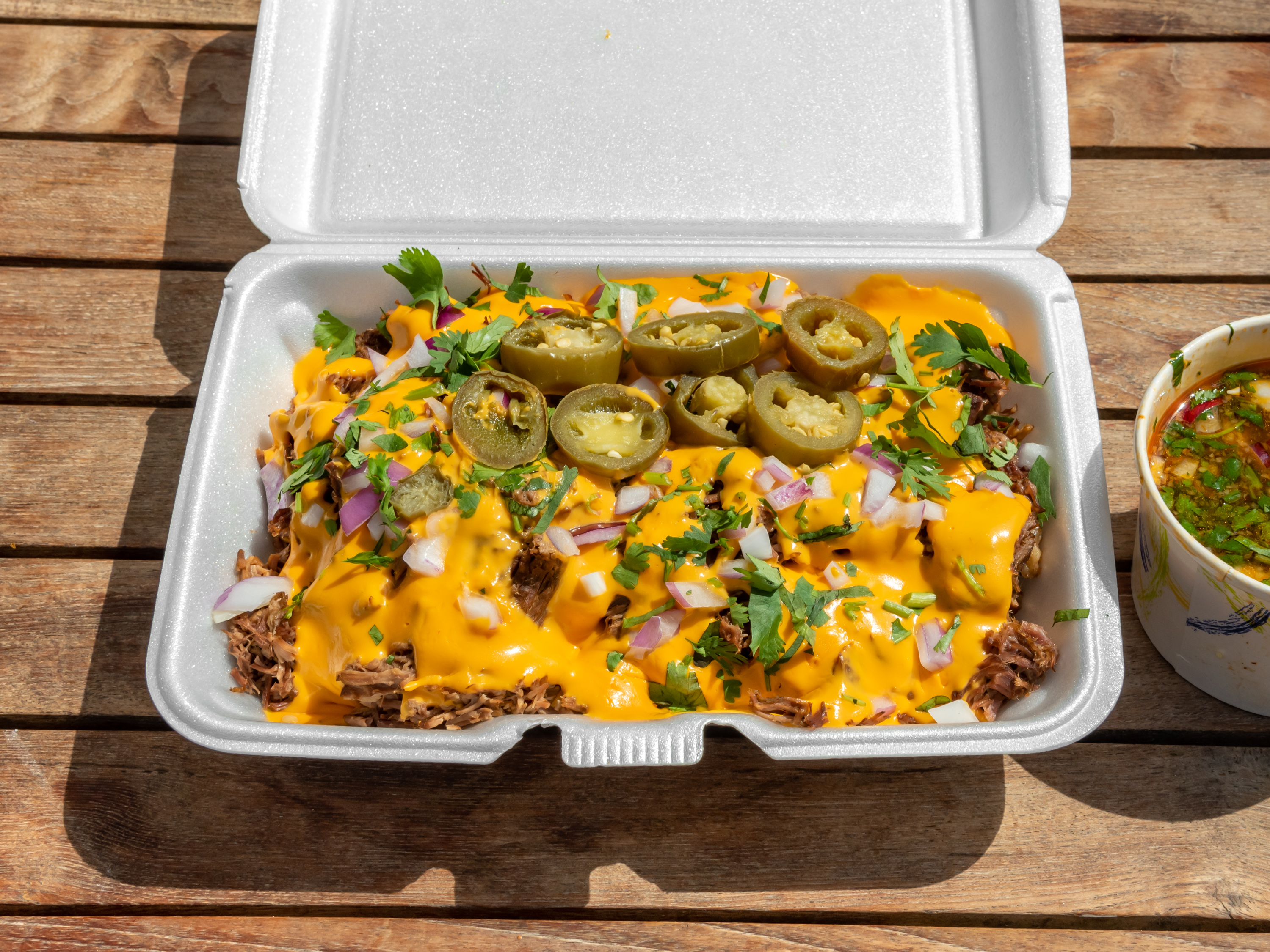 Order Birria Nachos food online from Peter's Crunchy Red Tacos store, New York on bringmethat.com